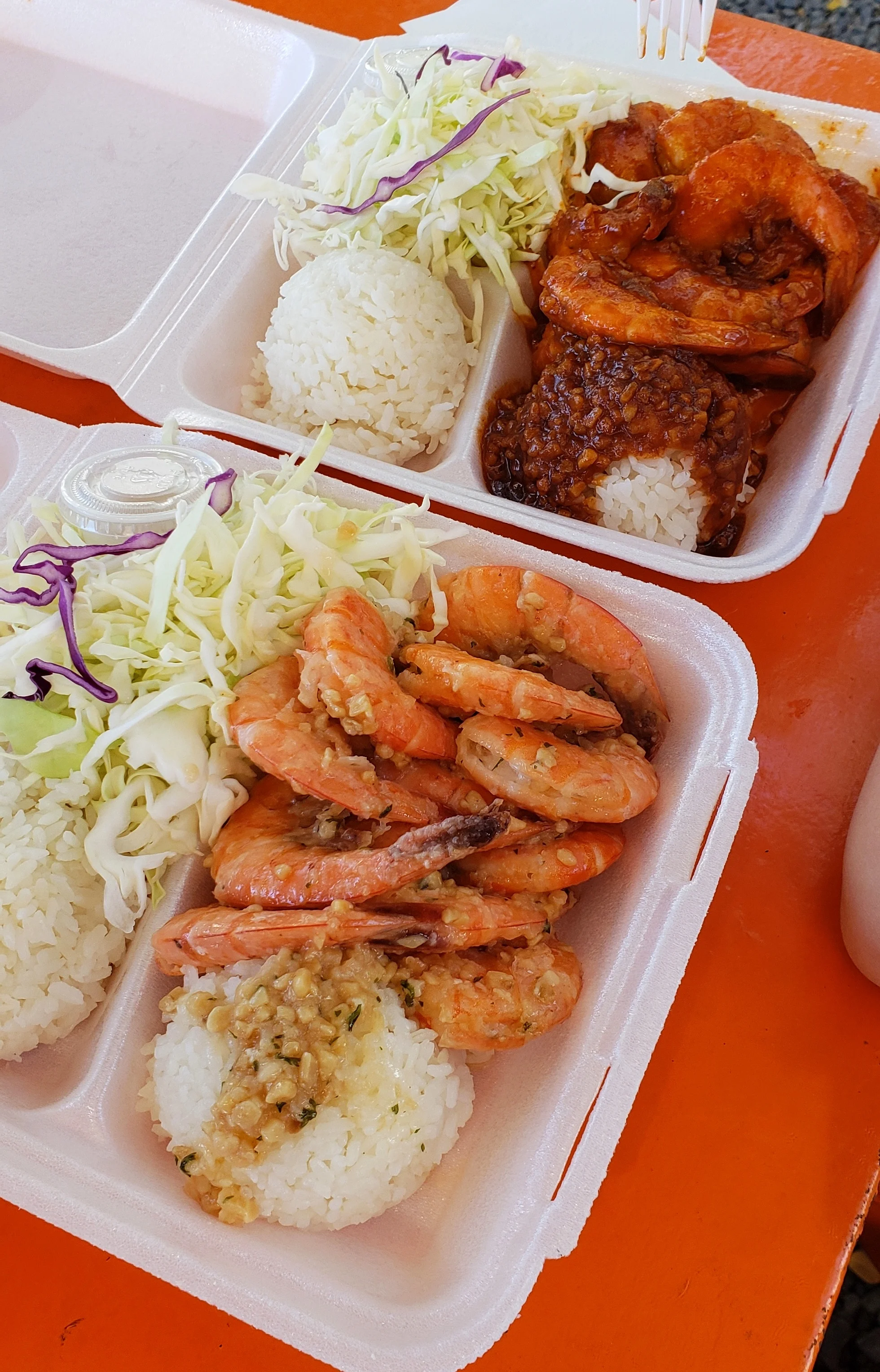 Garlic shrimp plates (one spicy and one regular) at Honos Shrimp Truck.