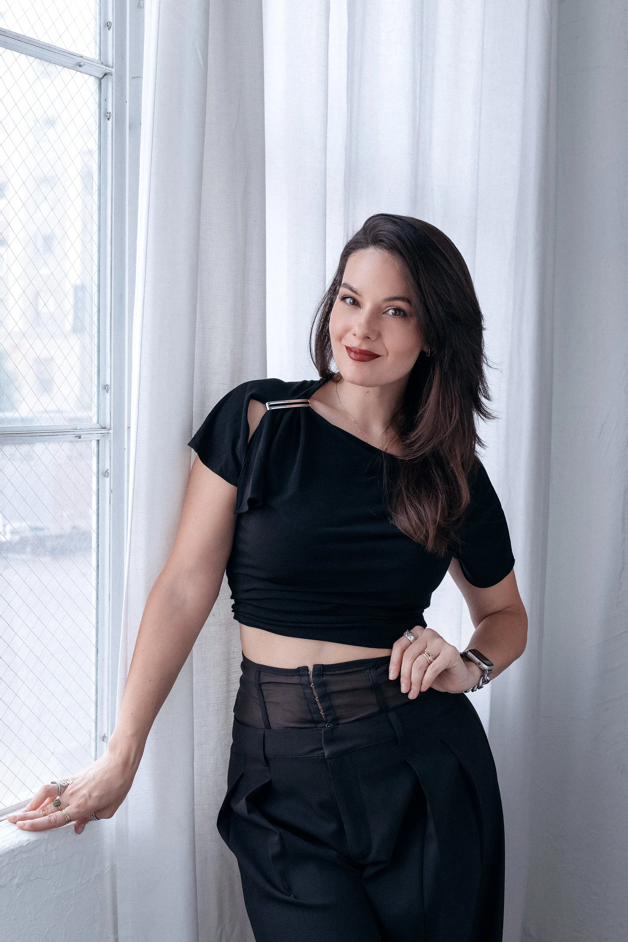 Brynne Zaniboni posing in front of a window