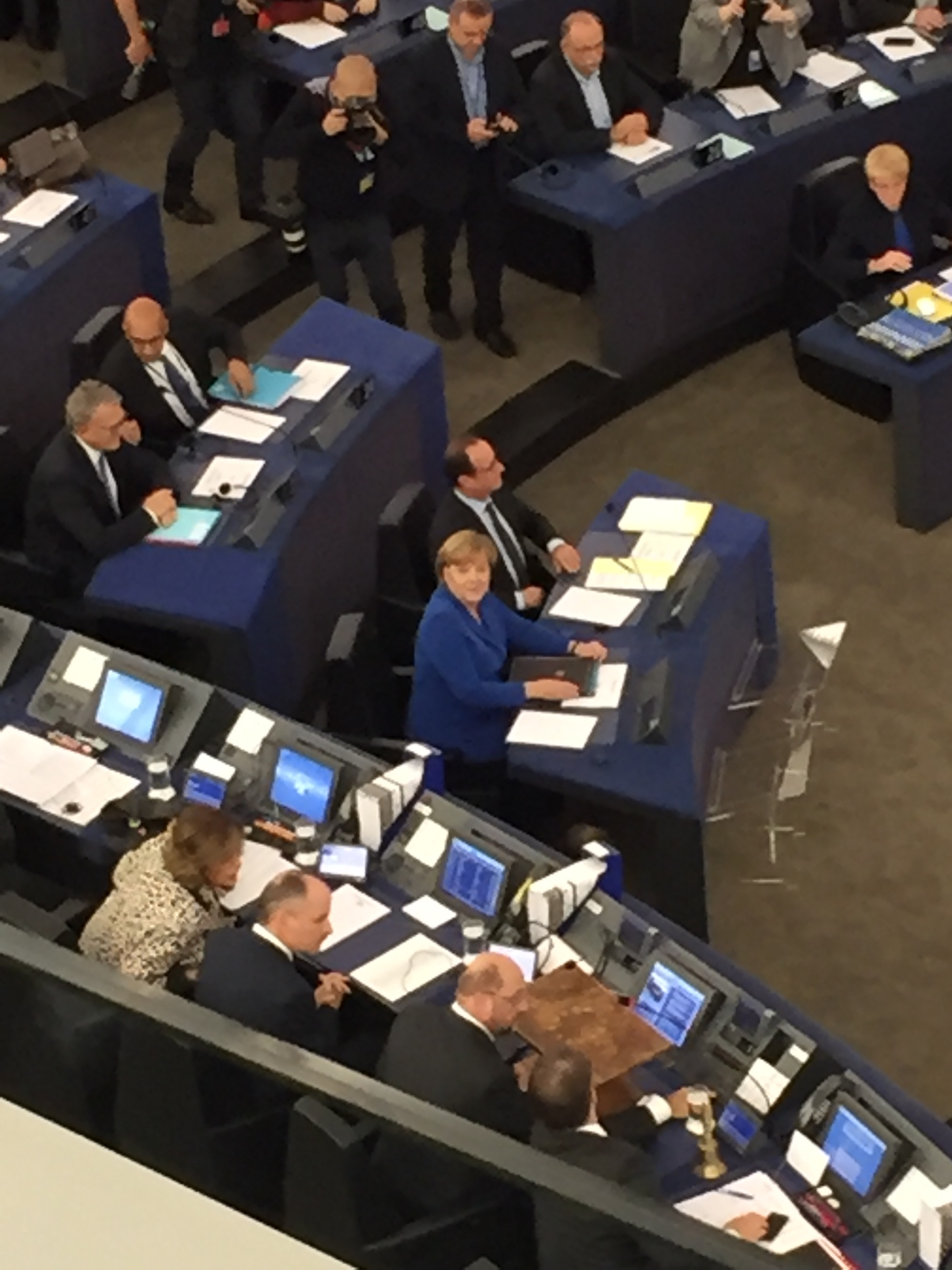 The potato quality picture I took of Chancellor Merkel staring into my soul. Also, François just chilling out, as he is wont to do.