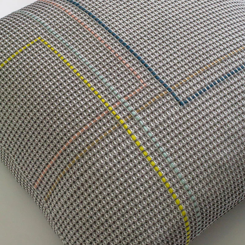 Hand embroidered organic cotton charcoal square cushion close up