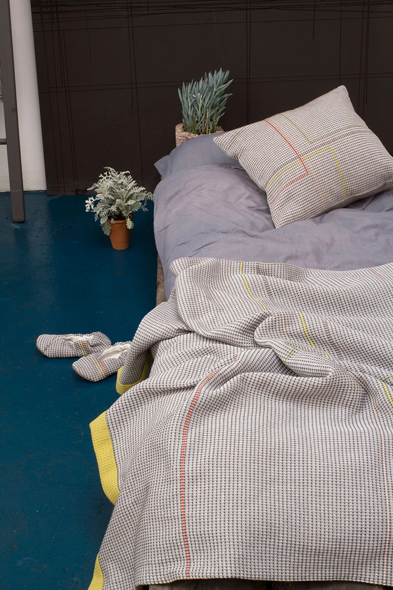 Hand embroidered charcoal and olive throw
