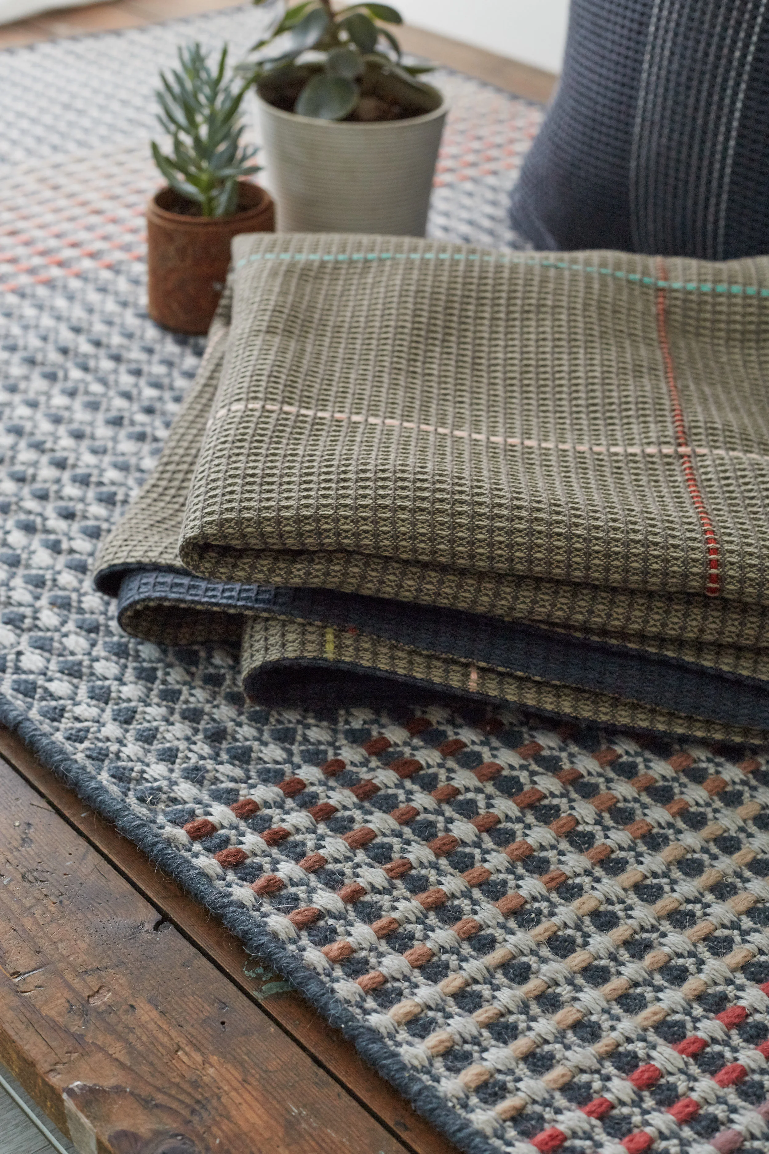 Hand embroidered taupe and navy woven throw