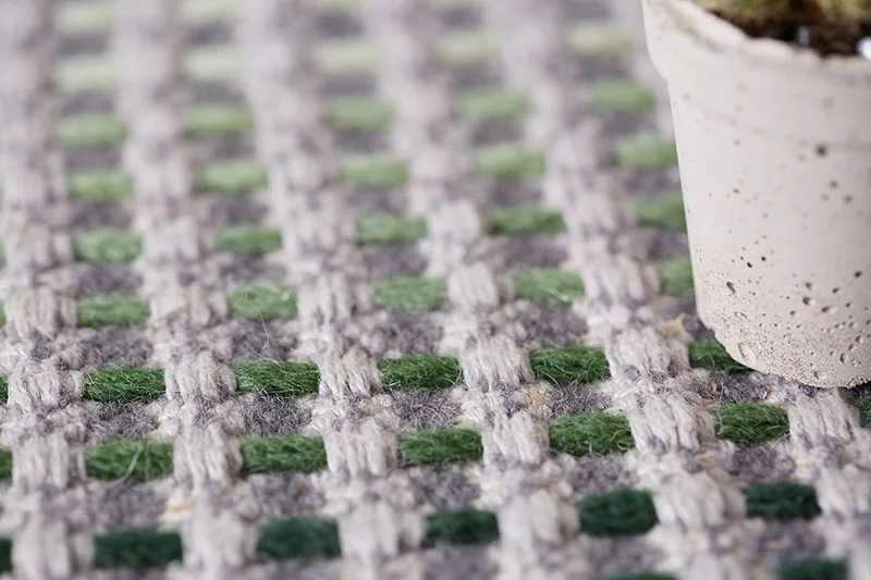 green embroidery on light grey base
