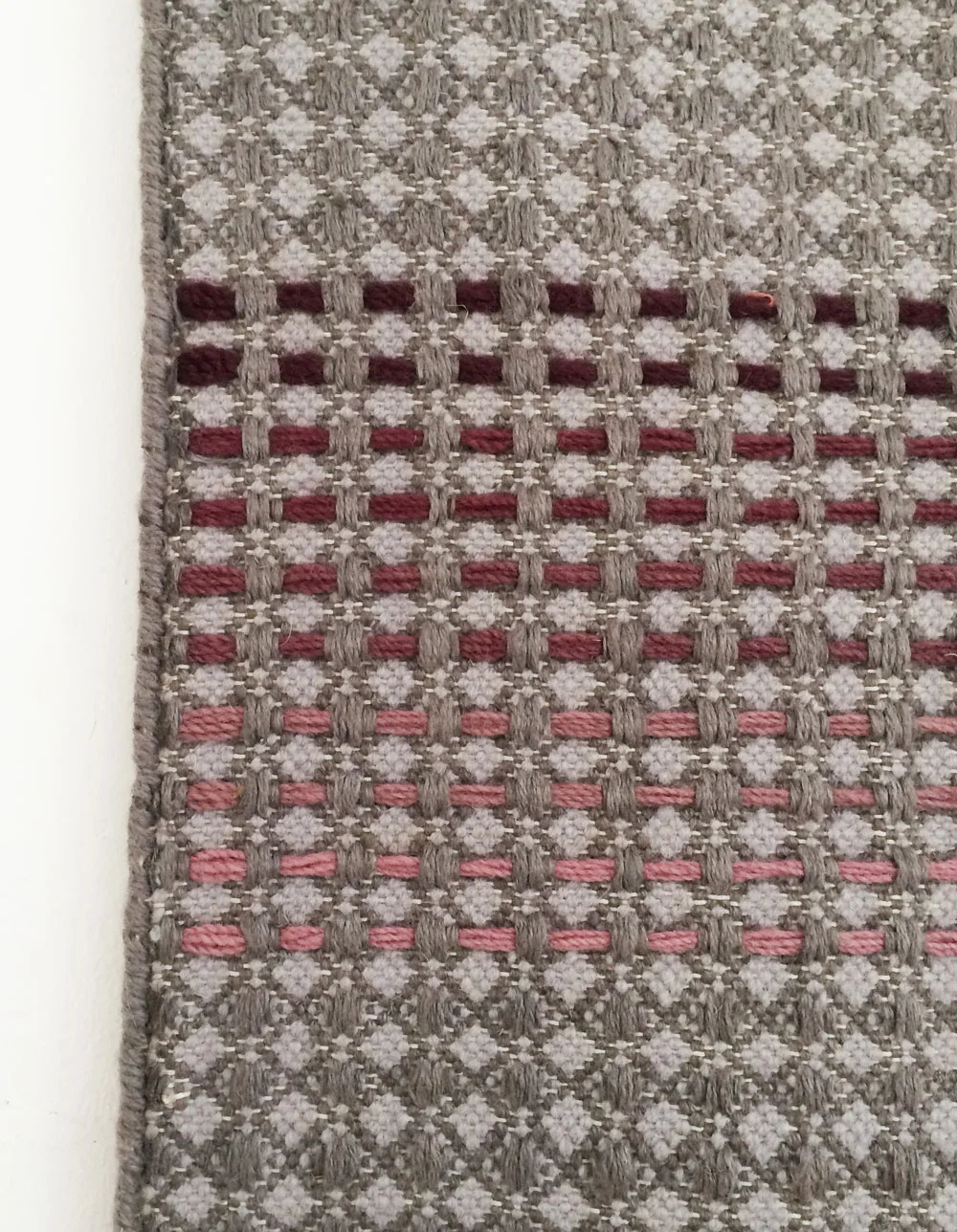Plum rust embroidery stripes close up