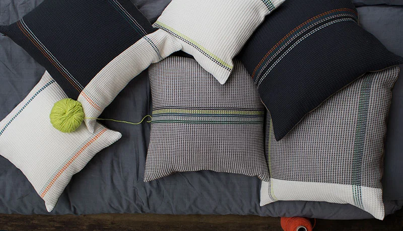 NeonCollection-50x50cNavy-or-Charcoal-WAFFLE-cushion-with-wide-multi-stripe-&canvas-reverse-RRP£75.jpg