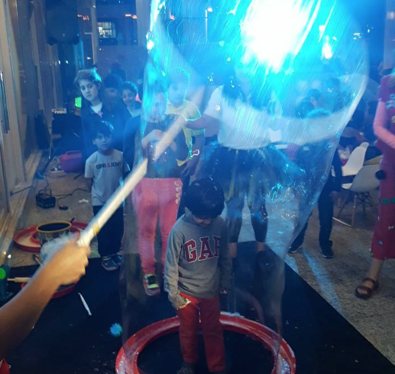 My youngest- Lil M, enjoying the Giant bubbles at the inaugural of 'The Beehive', his brother Nicky is looking on with keen eyes!