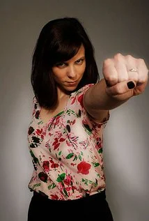 Sarah Burns is probably best known for her roles as the self-sabotaging lush Hailey, in the film "I Love You, Man" and for her portrayal of the conflicted Krista in HBO's award winning series "Enlightened", alongside Laura Dern and Mike White. Sarah performed at NYC's Upright Citizen's Brigade Theatre in New York City for over 7 years and credits the theatre with both keeping her out of trouble and contributing to her enormous array of wigs and sketch props. Her credits include the Nicole Holofcener film "Enough Said," Comedy Central's "Drunk History," "The New Girl" as well as "The Mindy Project,". She can be seen as Abby in the current season of the FX show “Married” and as ADA Emma Sinclair ABC’s “How To Get Away With Murder,” as well as the upcoming film “Brother in Laws,” and the IFC film "Slow Learners". Sarah thinks Portland rocks and that it rolls too.