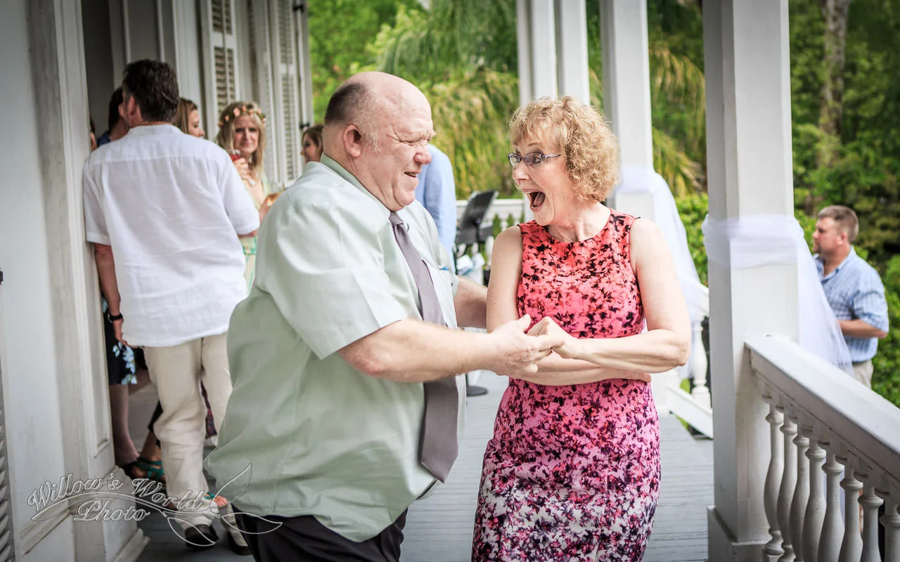 The parents of the bride go for a (literal) spin on the porch of a lovely Garden District home...