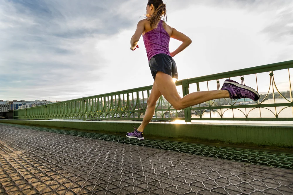 Photo by Stephen Matera. Dr. Elena Zinkov running for Topo Athletics.