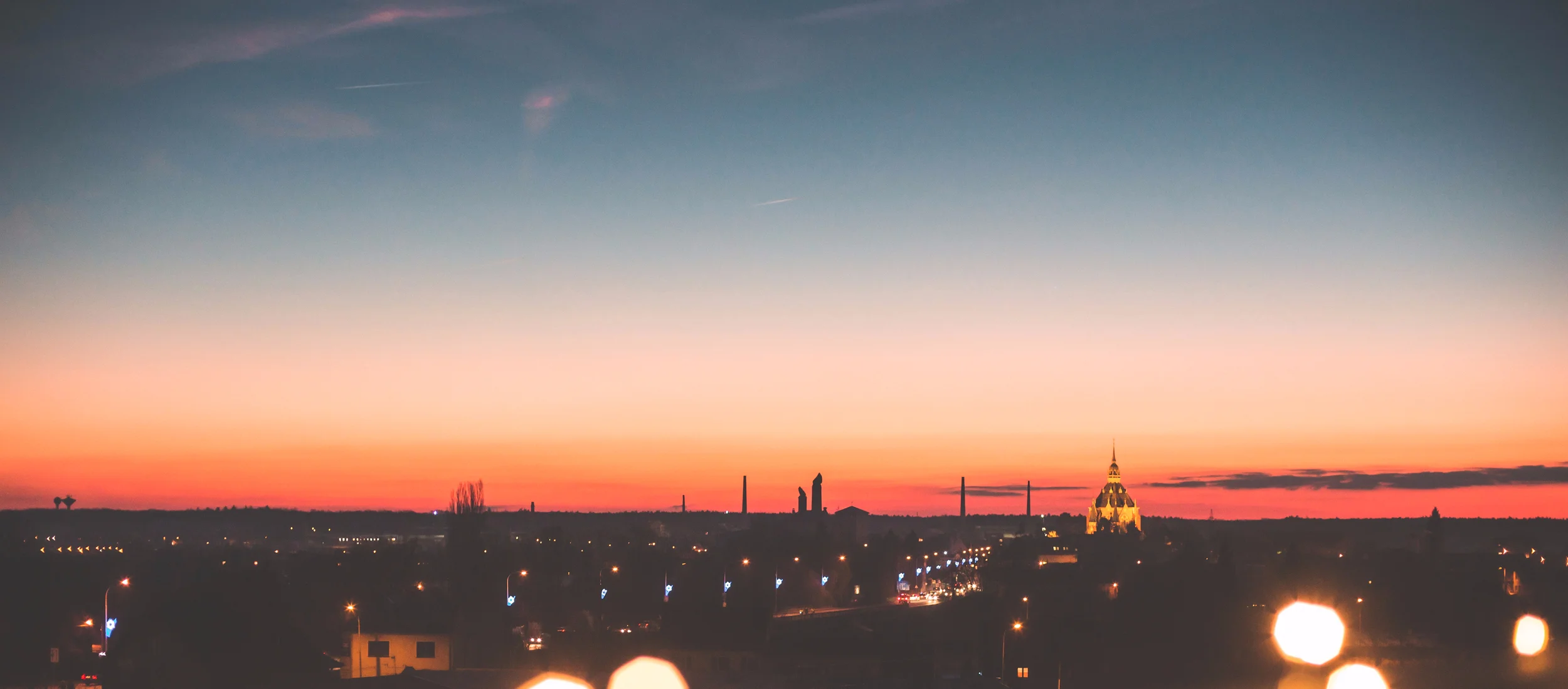 sunset-cityscape-with-bokeh-lights-picjumbo-com.jpg