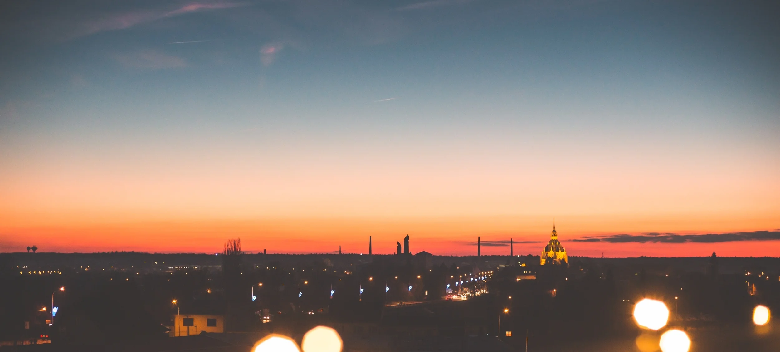 sunset-cityscape-with-bokeh-lights-picjumbo-com.jpg