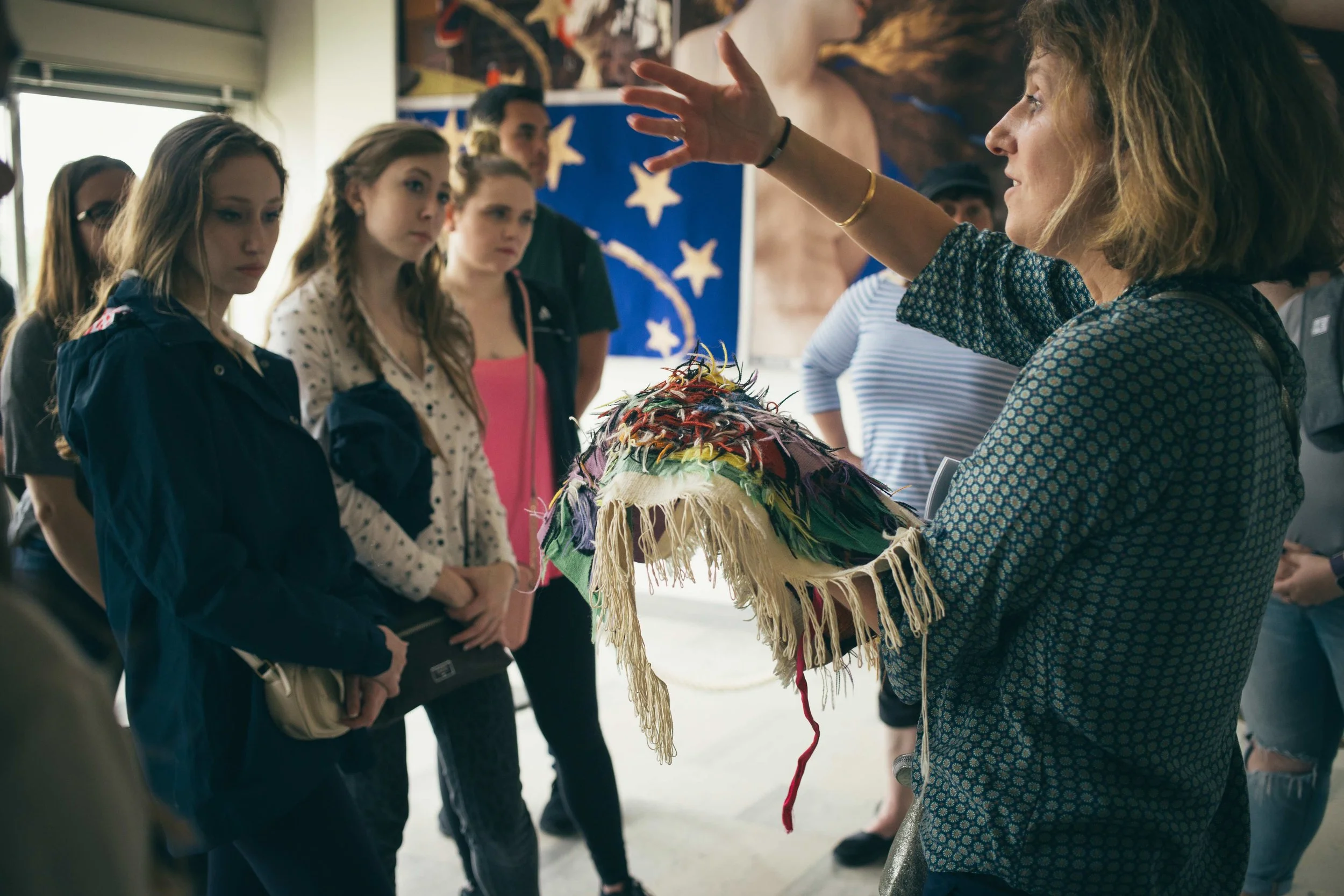 A guide shows us the underside of a tapestry and explains the process.
