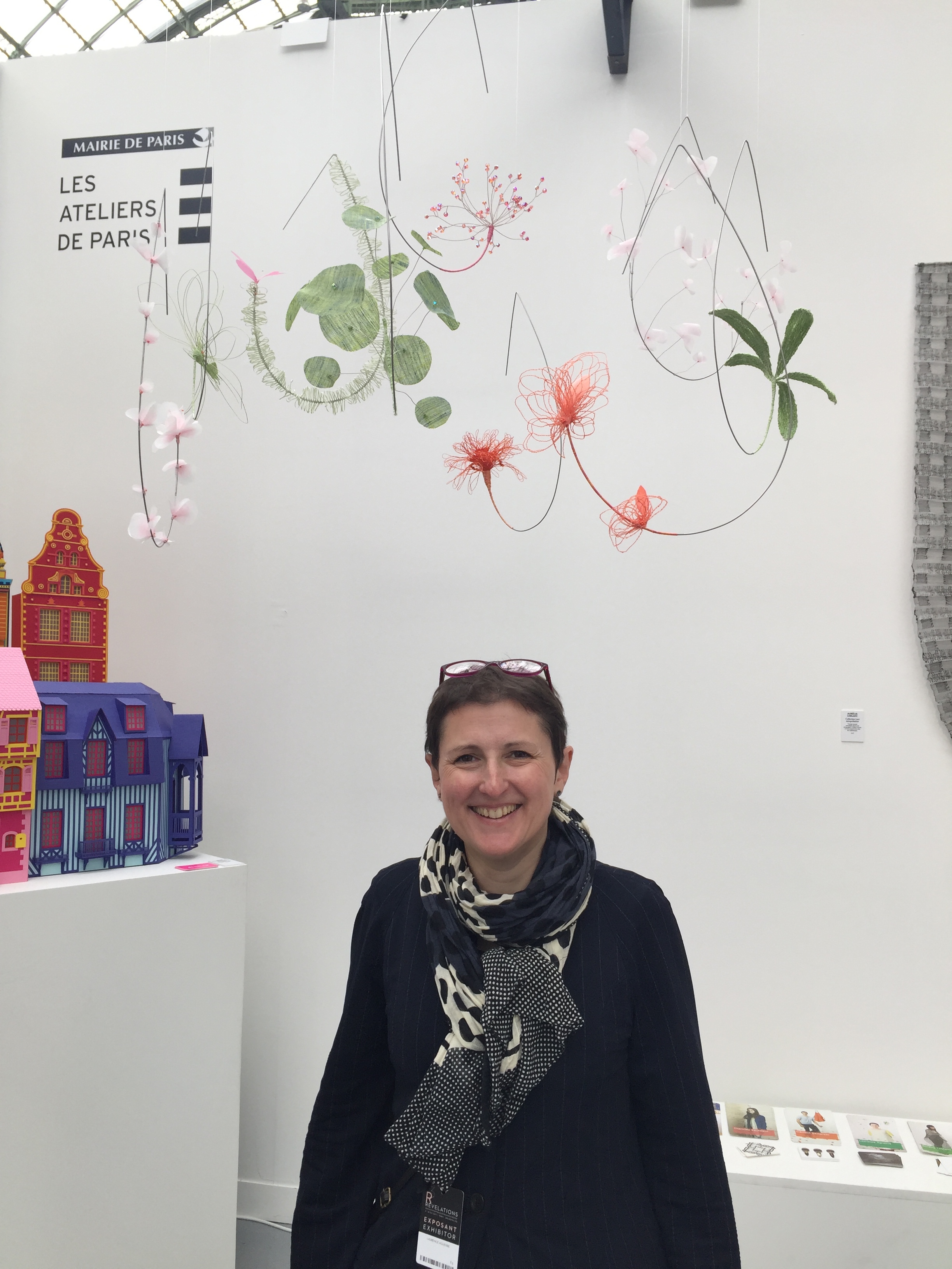 Laurence at the Ateliers de Paris booth at the Grand Palais biennial exhibition or French craftsmanship with her floral mobile