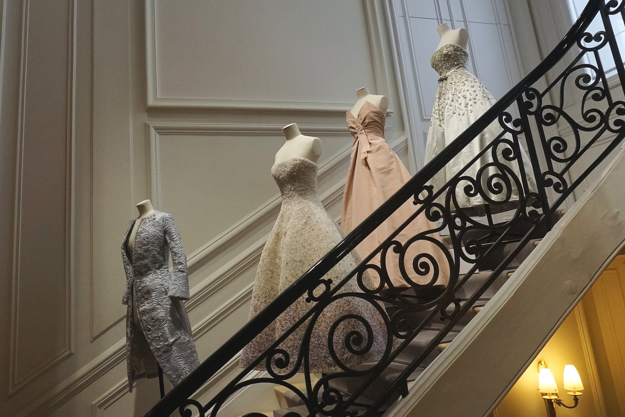 The staircase at Dior Avenue Montaigne with dresses by Raf Simons