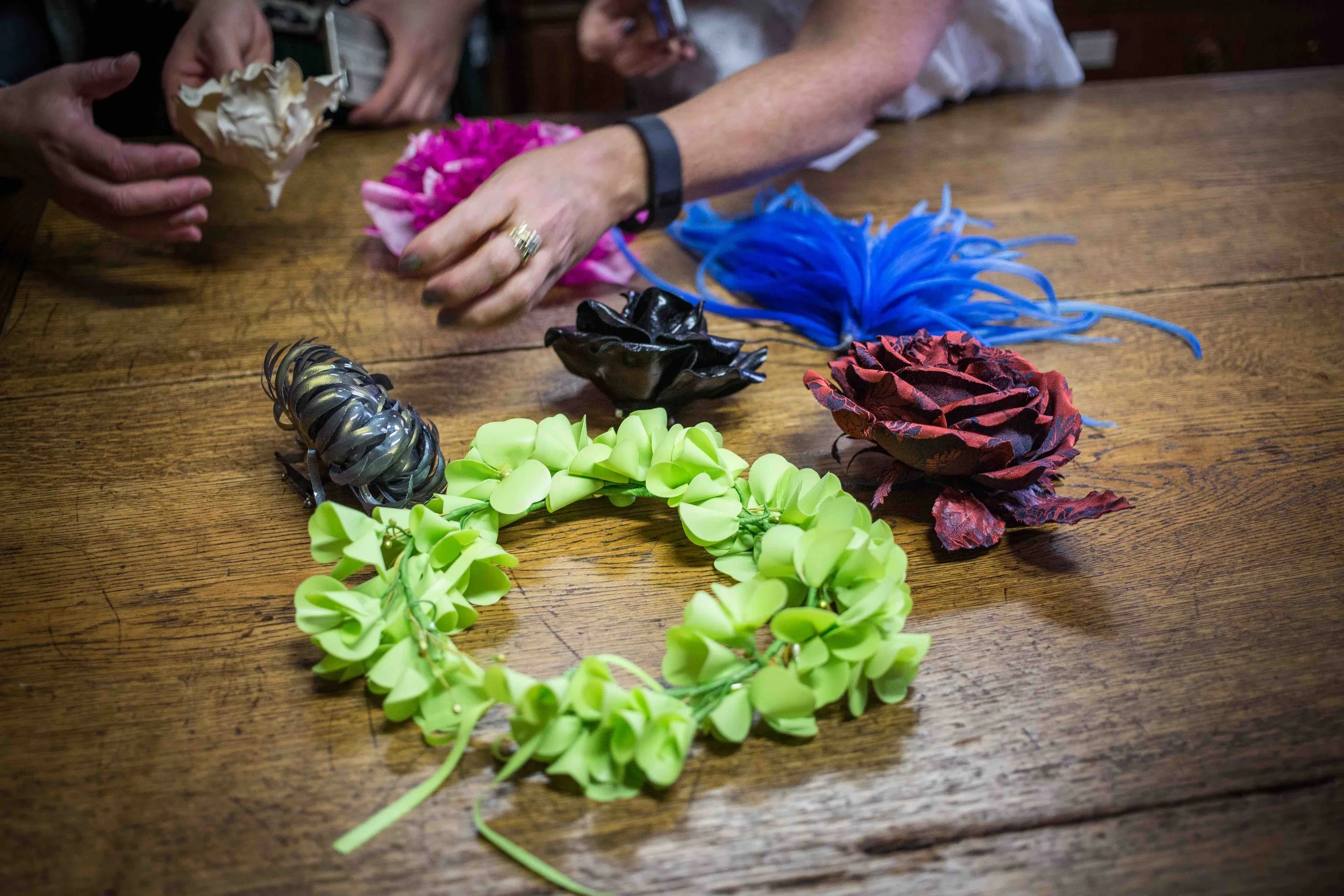 Handmade flower samples on a work table at the atelier Legeron for fashion experience tours