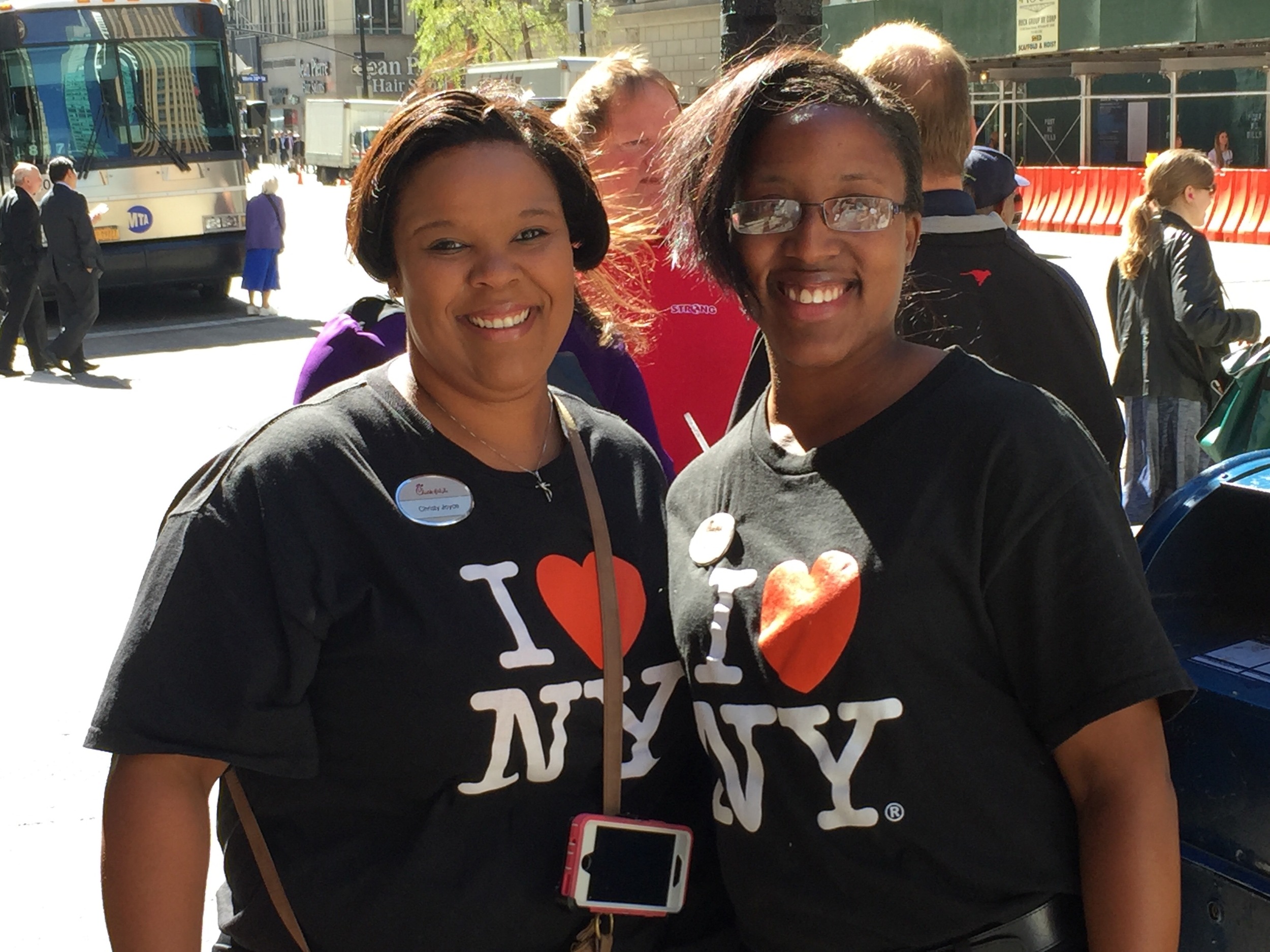 The customer service is still top notch at the NYC location of Chick-Fil-A. Two employees are all smiles after come off break and returning to work.