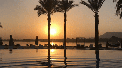 Sitting in the infinity pool watching the sunset over the Nile.