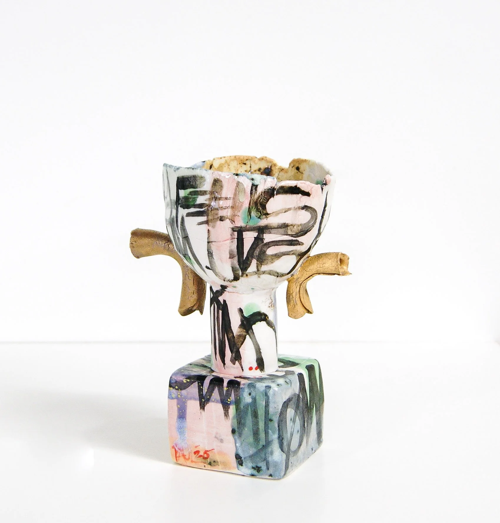 GunsUp_2026_porcelain,slip,glaze,goldluster_9inchesX5inchesX4inches_paulymaloney.jpg