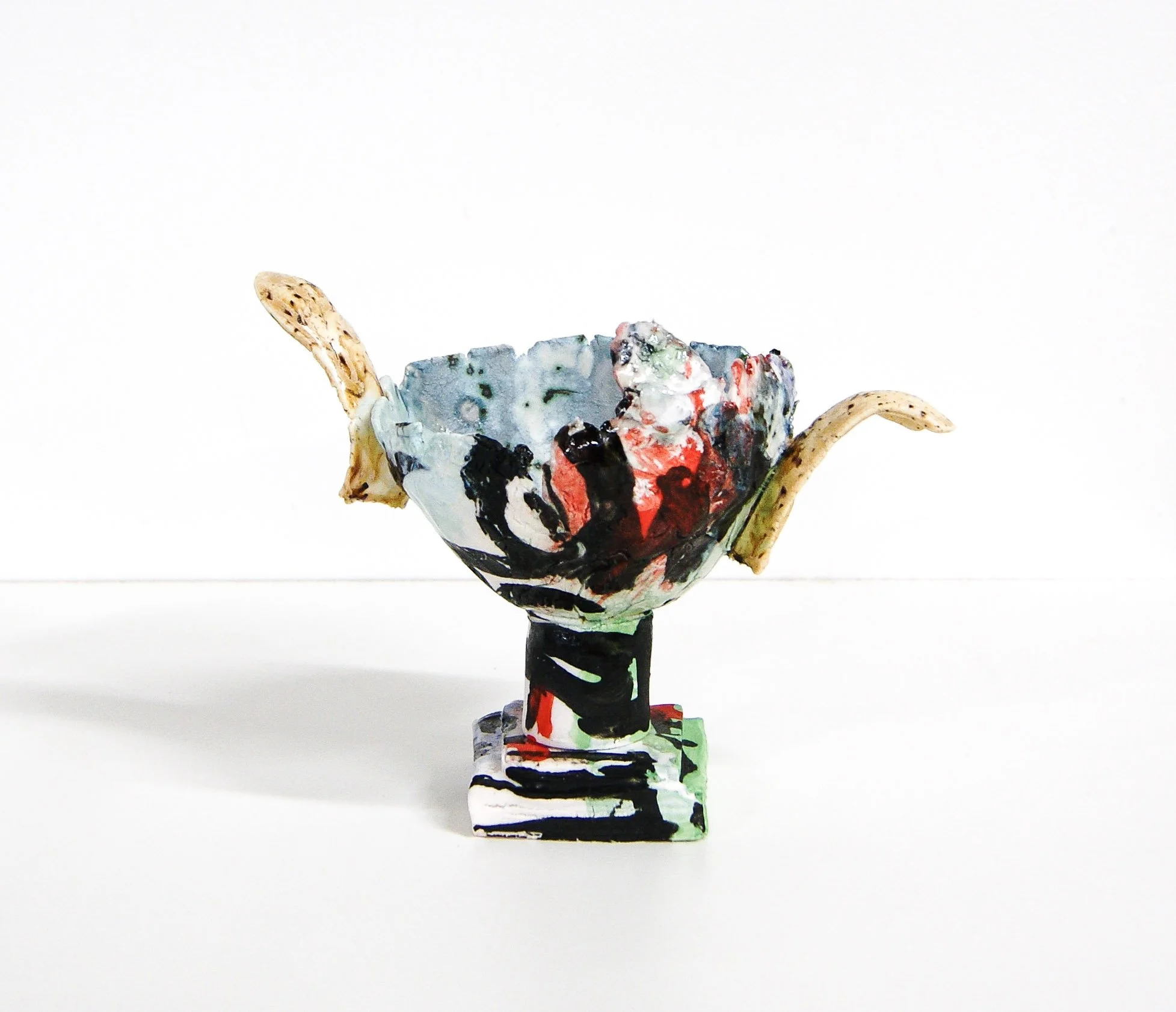CowardsStarve_2026_porcelain,slip,glaze_7inchesX6inchesX4inches_paulymaloney.jpg