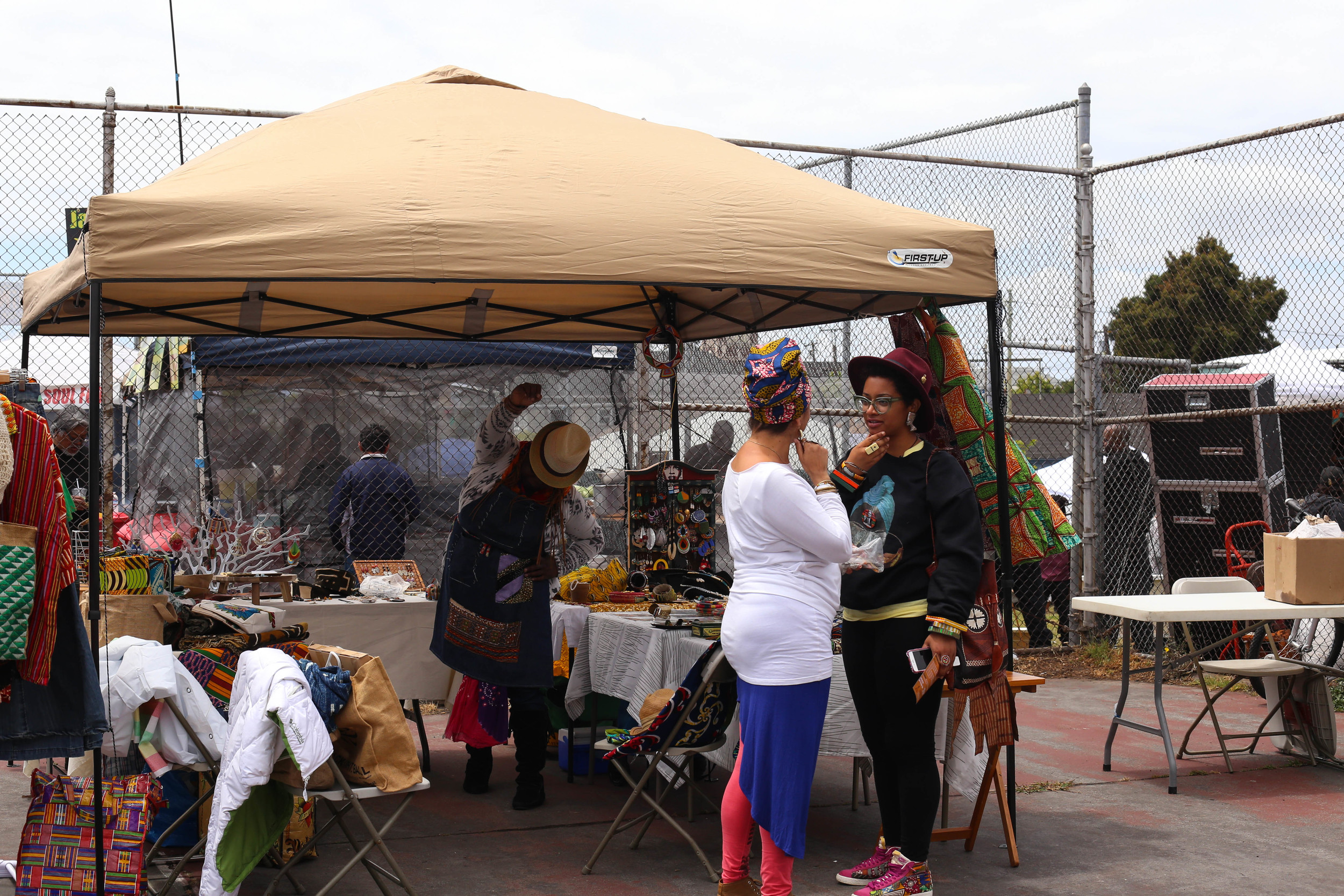 Mercedes Martin from Oakland talks with another vendor.