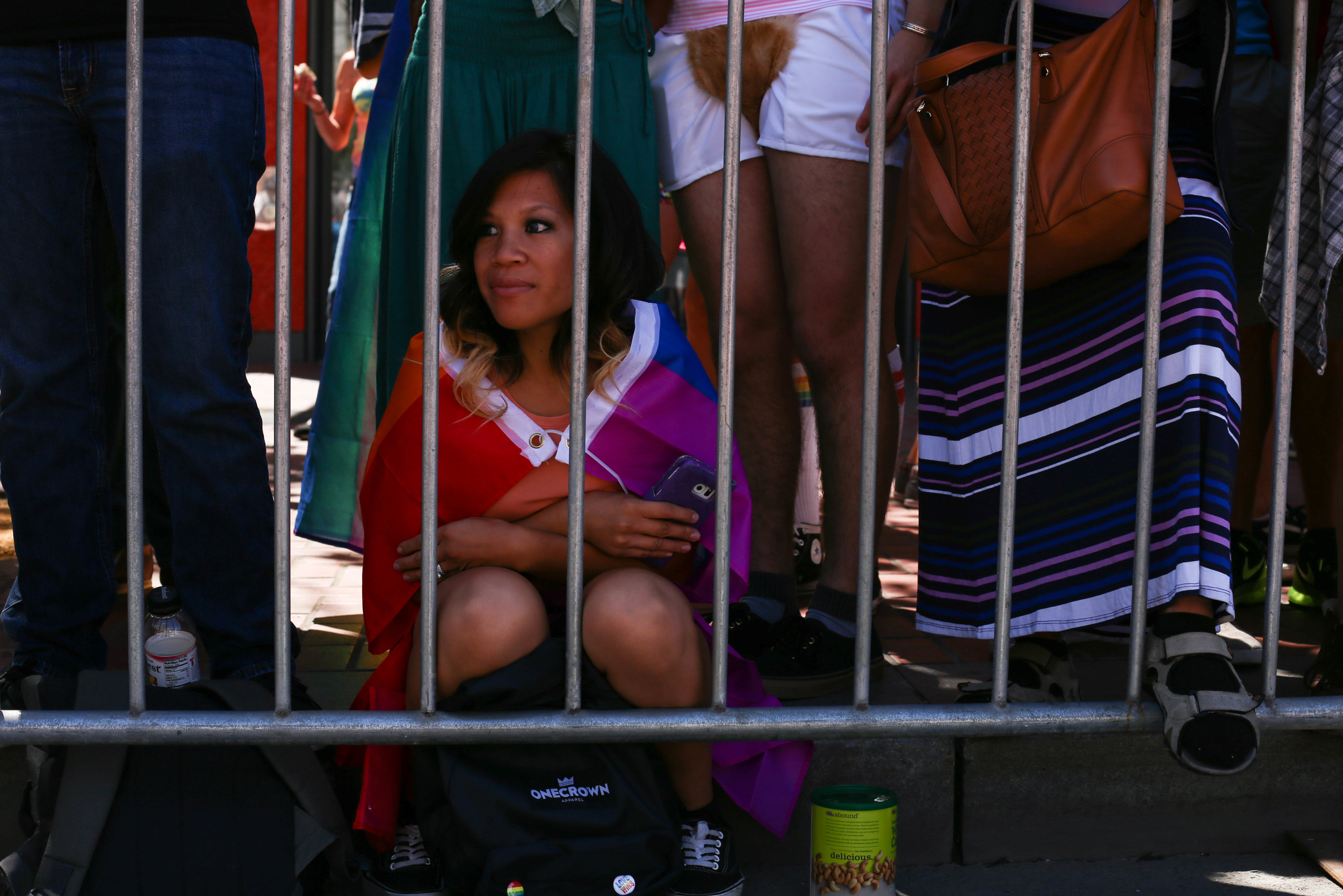 Emerald Rubio (San Jose, Cali.) watches the parade with her mother for the first time as thousands gathered to celebrate Pride in San Francisco, Cali. Sunday, June 26, 2016. 