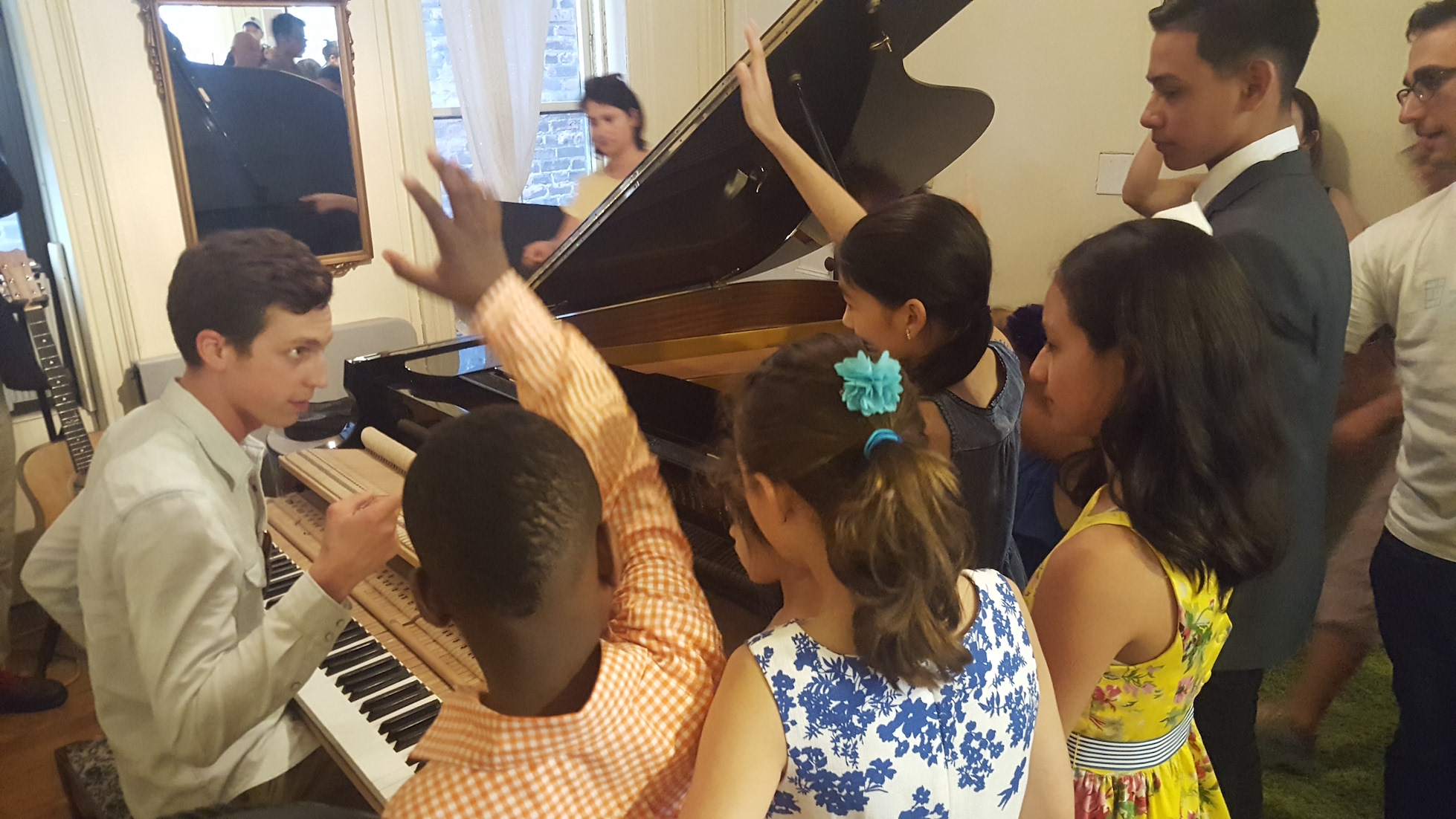 Isaac from Orpheus Piano Co. takes questions from the audience about the inner workings of a grand piano!