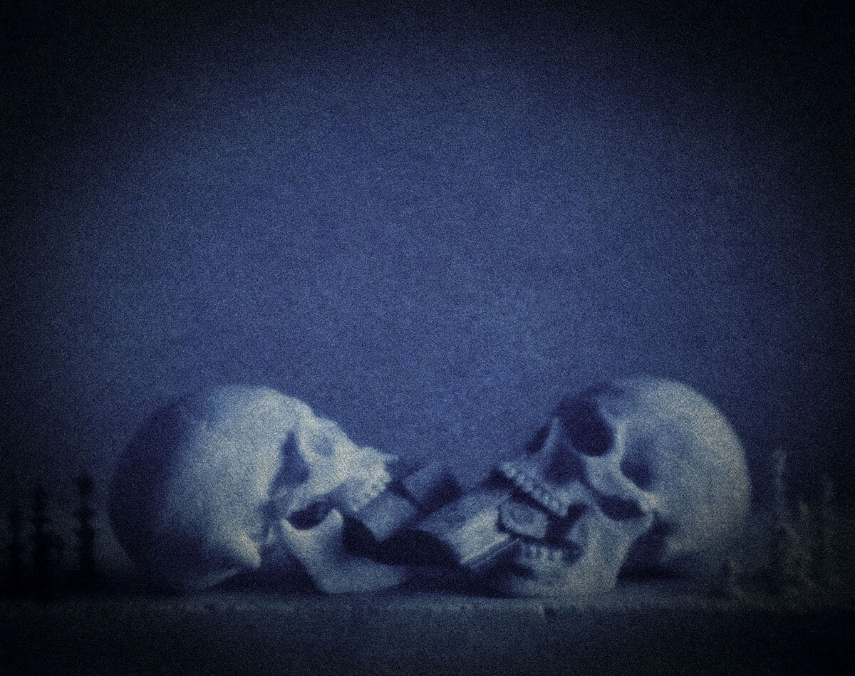 Two Skulls Struggling Over an Alchemical Text