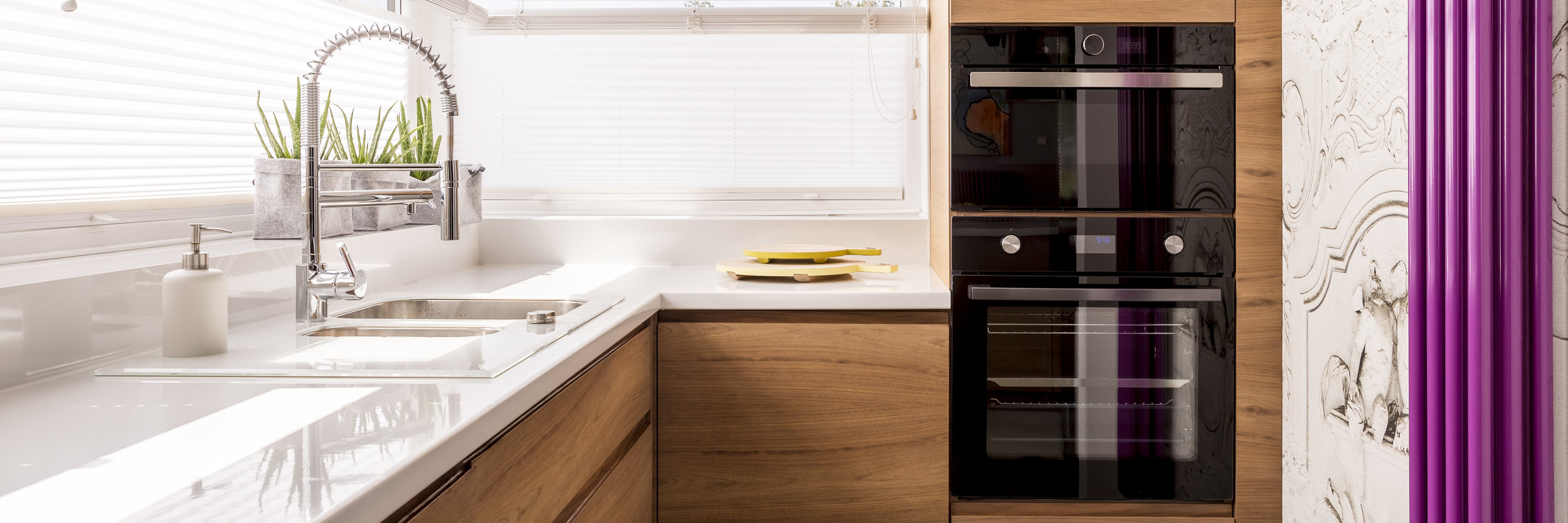 Kitchen with white glossy countertop.jpeg