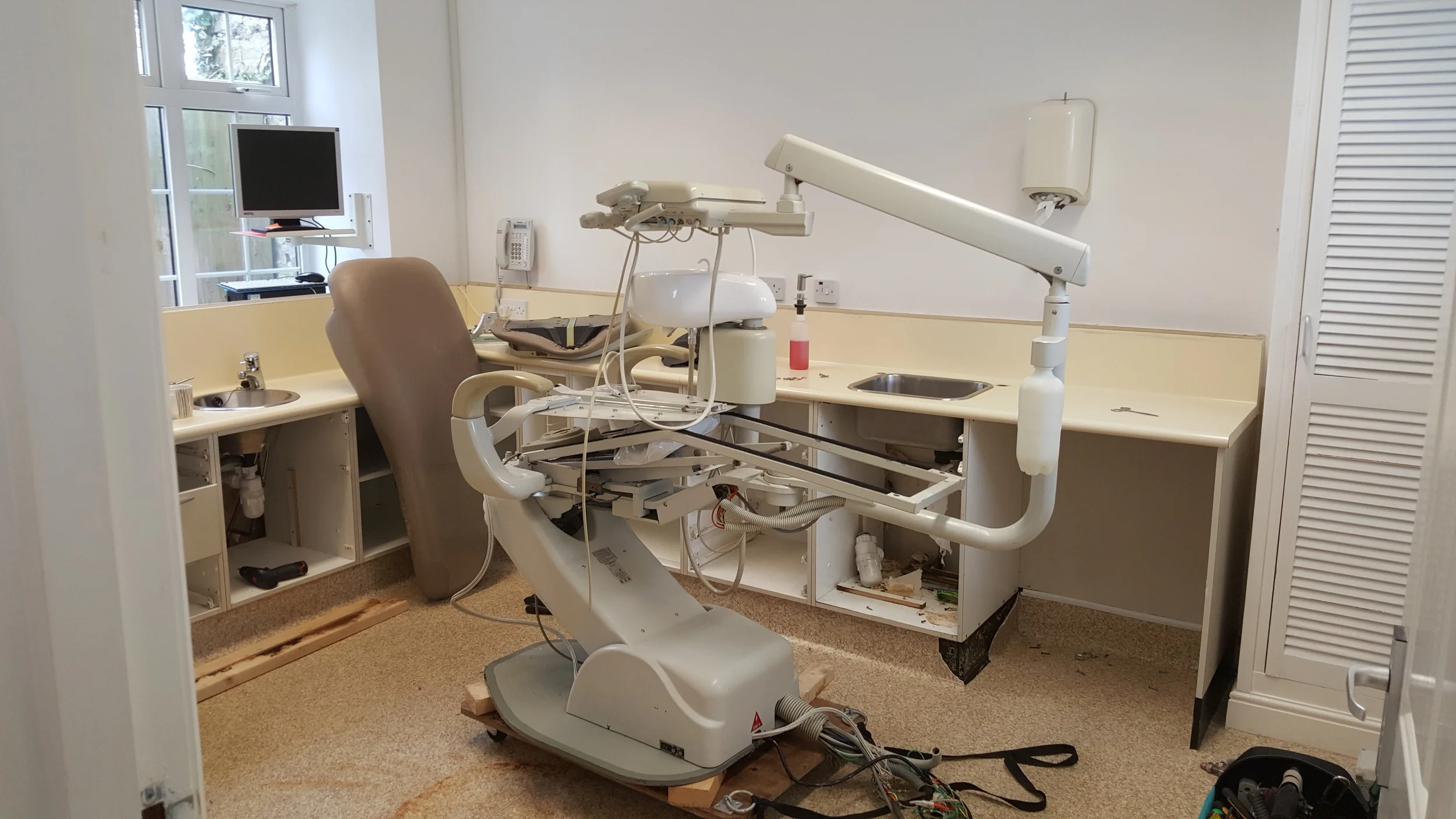 Chair being broken down to get it out through the door on a dolly. They are mighty heavy!