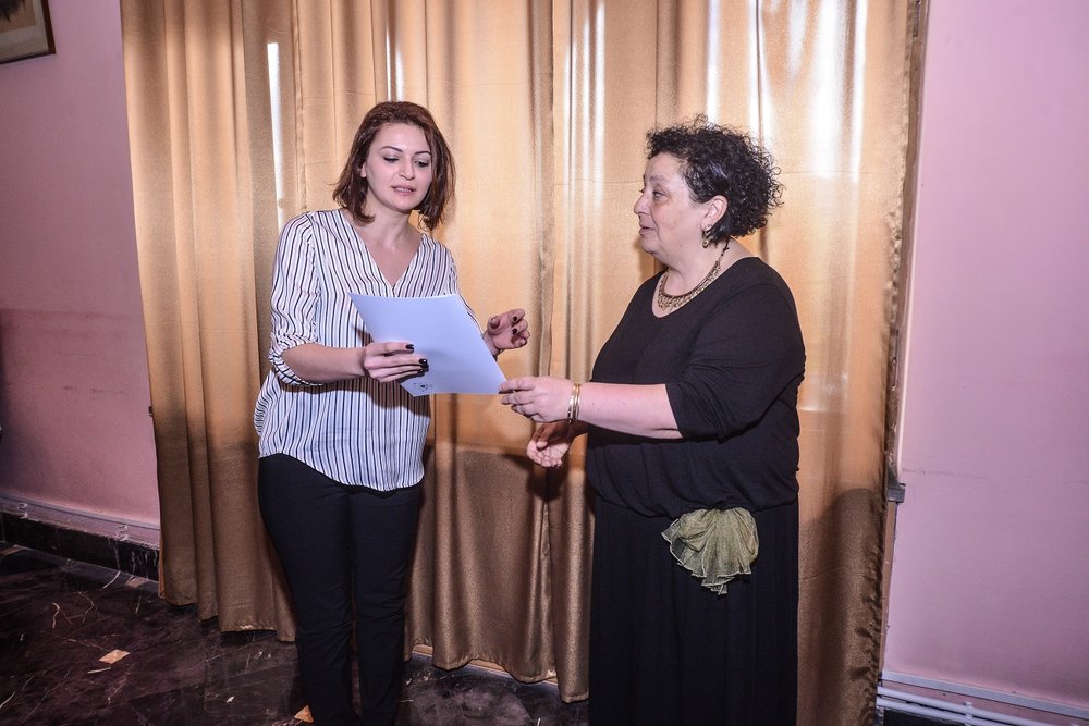 19  Margarit Piliposyan awarding ANSEF 2019 scientits with certificates.JPG
