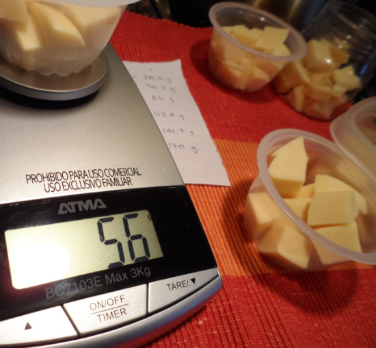 56.7 grams equals 2 oz of cheese. Shown here is a semi-hard cheese called Fynbo, similar to Monterey Jack.
