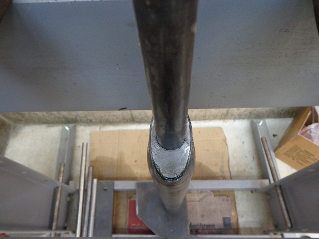 60mm round tubing being made into proper size oval in hydraulic press.png