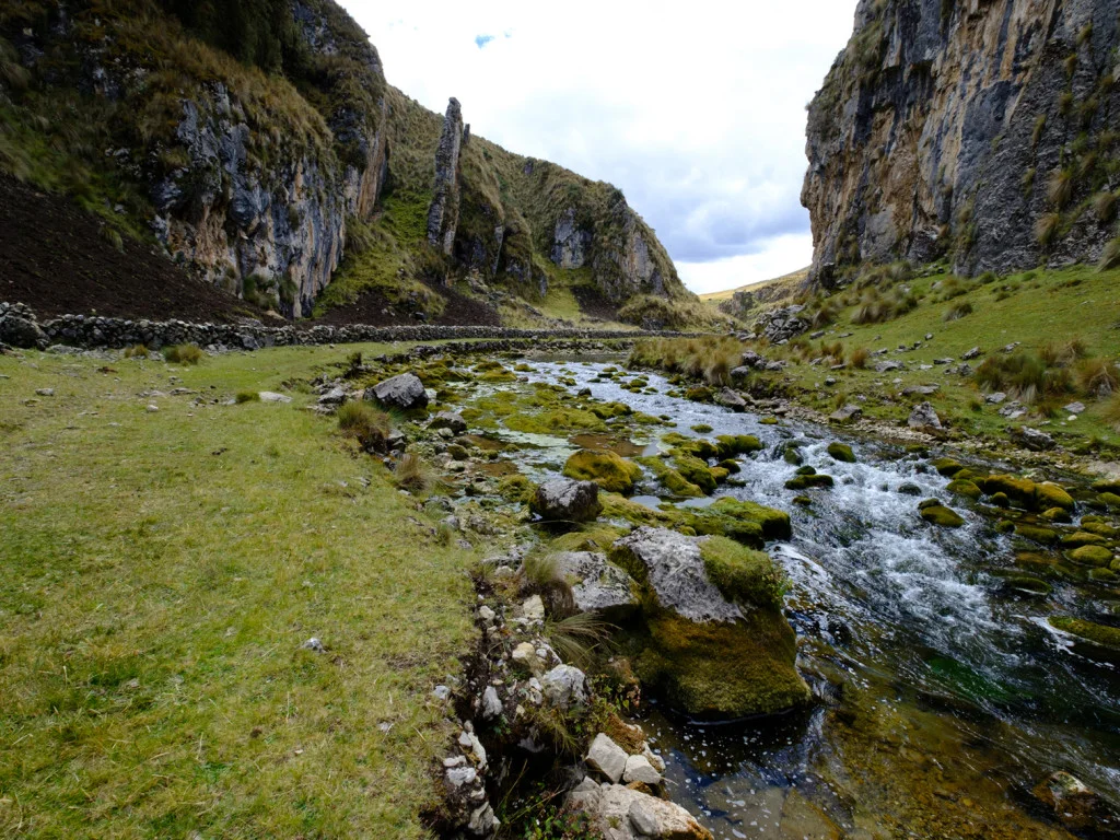 Taparaco River running beside Qhapaq Ñan roadway.