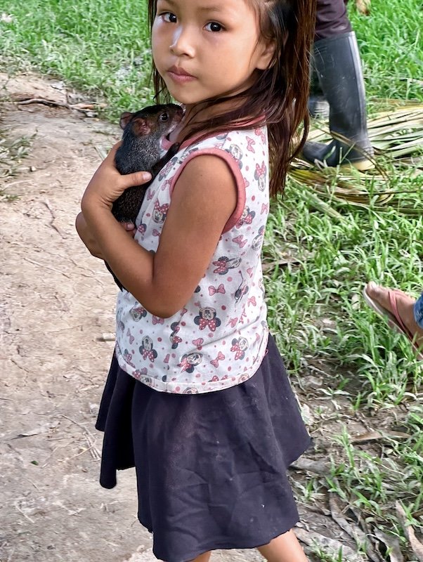 Miller x 2 - Cusco & Rio Amazonas Research Station - Village Girl with pet Tree Rat.jpeg