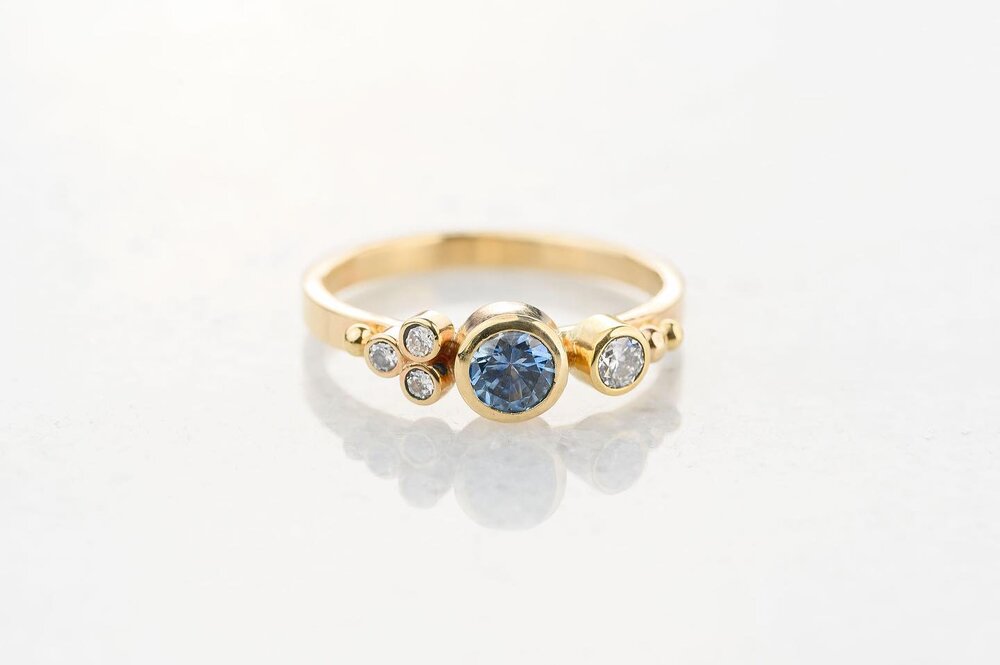 We&rsquo;re just too in love with this Not to post! Sweet Montana sapphire and diamond flower ring. Wear it alone or stack it with our bands. #ariojewelry #montanasapphire #madeinmontanausa #sapphirering #montanajeweler #jewelryofmontana #bigskymonta