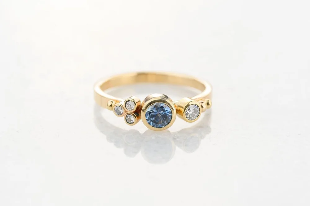 We&rsquo;re just too in love with this Not to post! Sweet Montana sapphire and diamond flower ring. Wear it alone or stack it with our bands. #ariojewelry #montanasapphire #madeinmontanausa #sapphirering #montanajeweler #jewelryofmontana #bigskymonta