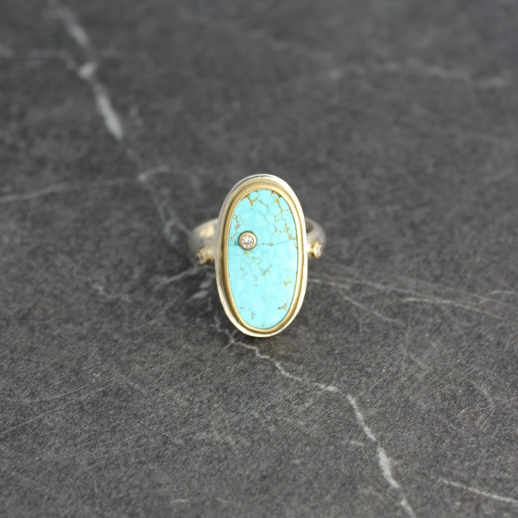 Long Organic Oval Southwestern Turquoise Ring Wrapped in Gold with Silver and Diamonds