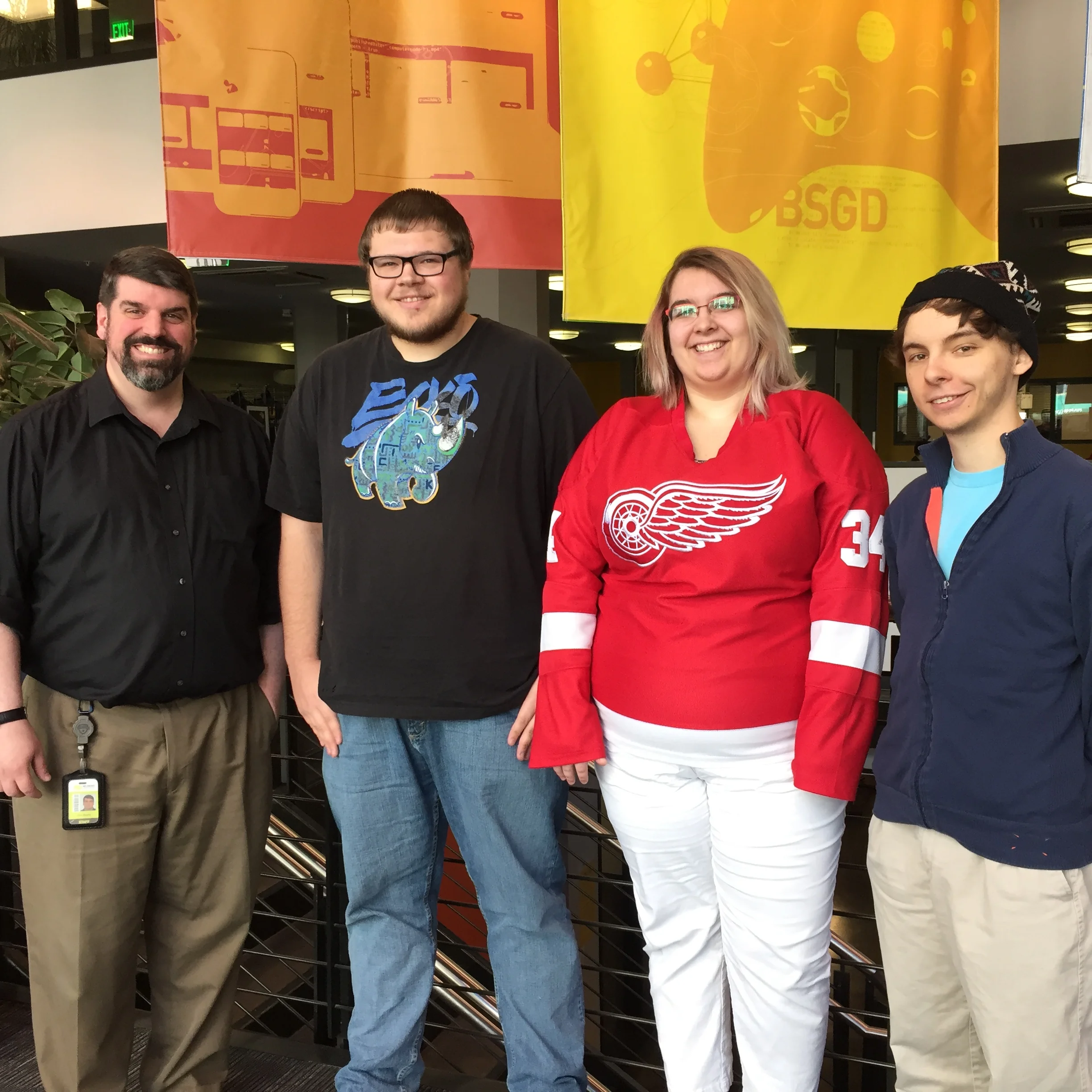 Tom Beatty, chair of the BSWD program, presented Cody, Rachel, and Kyle with their tickets to ng-conf. 