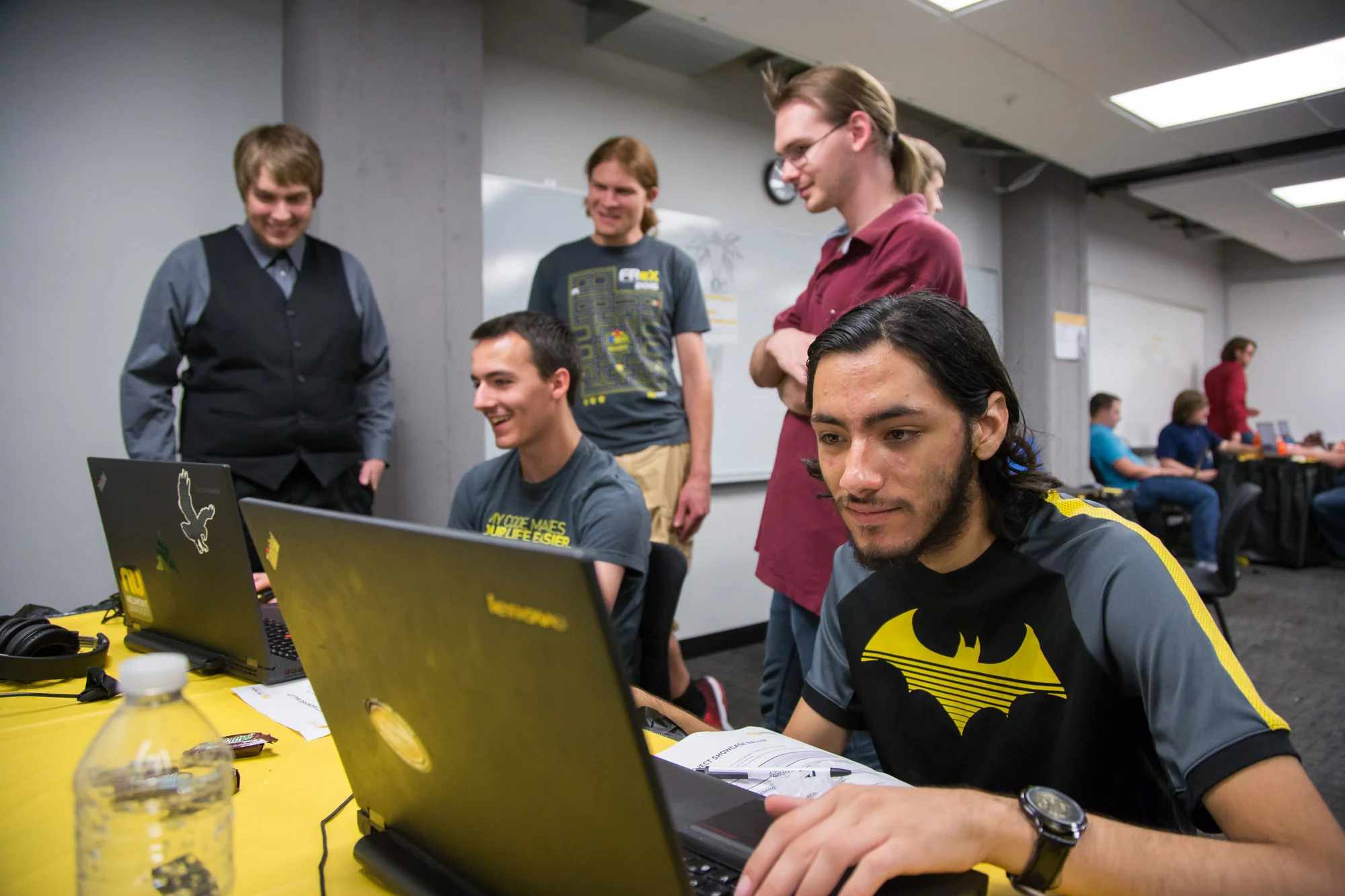 Students play "Rogue Bot" as the dev team looks on. 