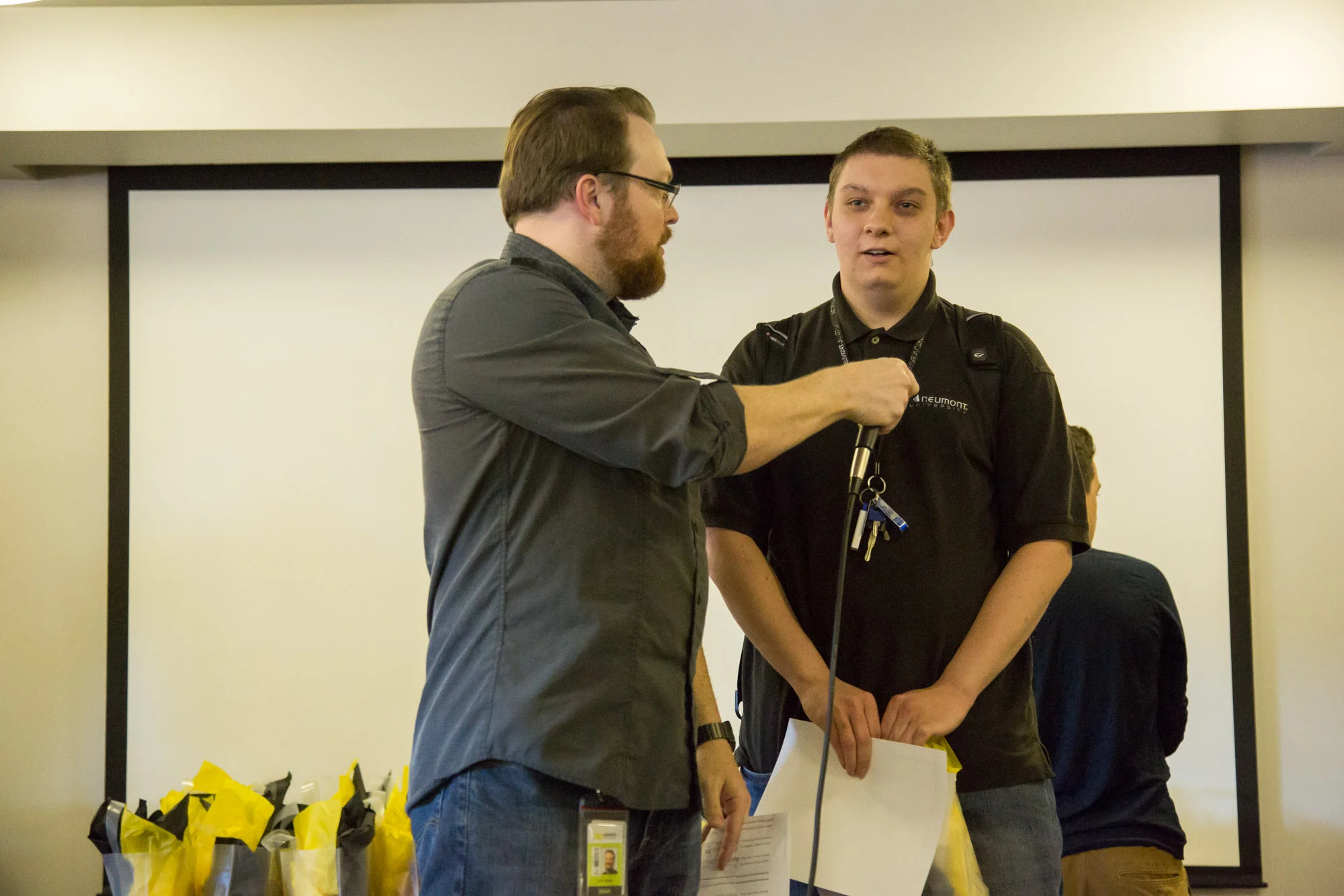 Adam Nogowski accepts the award on behalf of his team for their Enterprise Project with IGT.