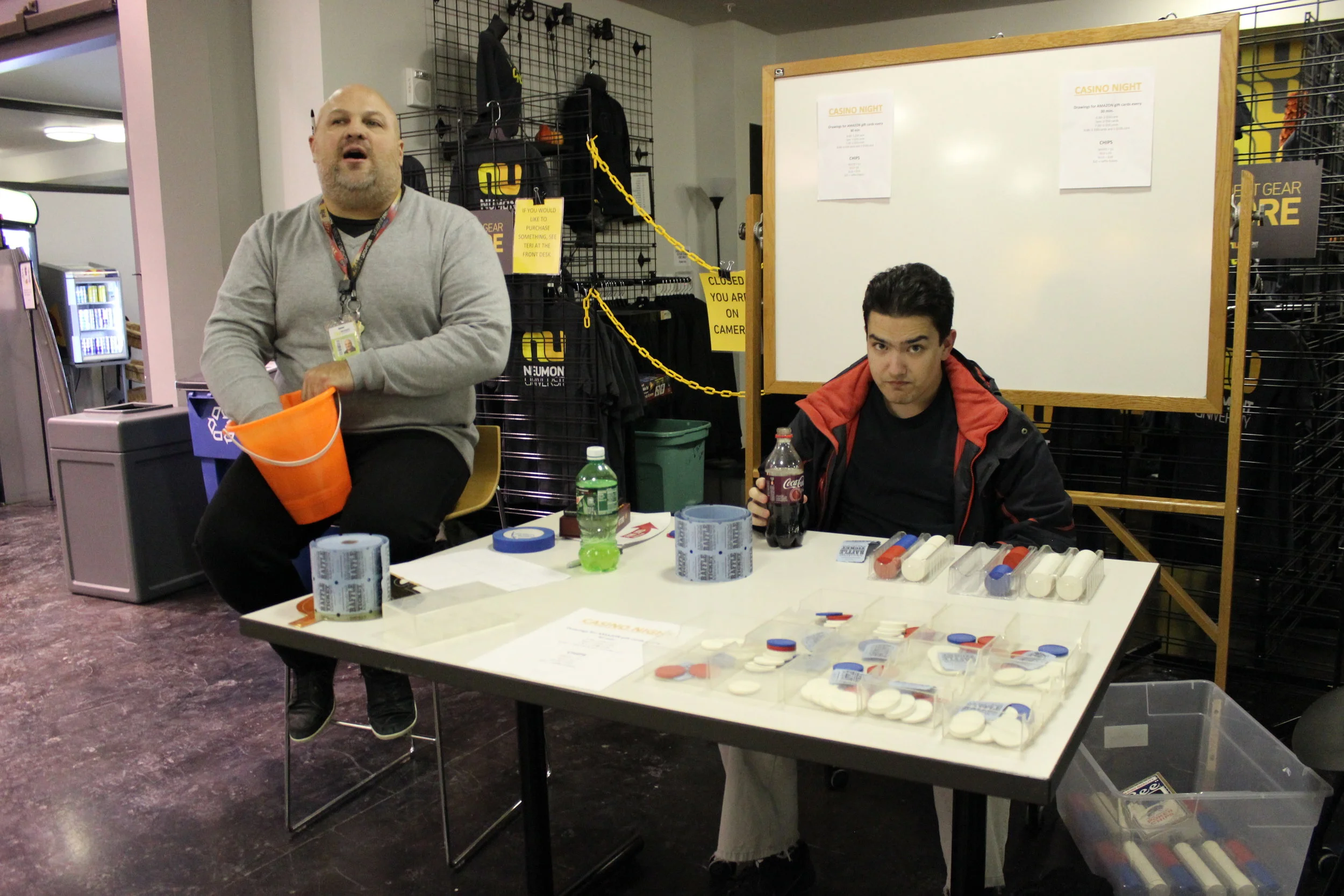 Senior Student Life Coordinator John Peppinger draws the winners during a raffle at Casino Night.