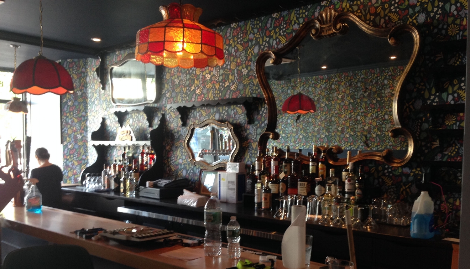 We designed and built the bar and backbar, including the cabinets, shelves and custom mirrors.