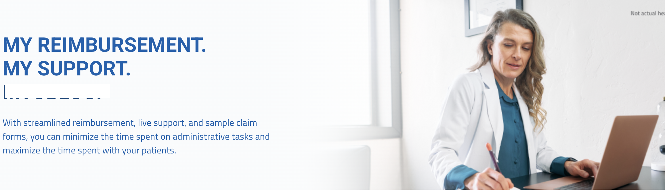 doctor writing at her desk