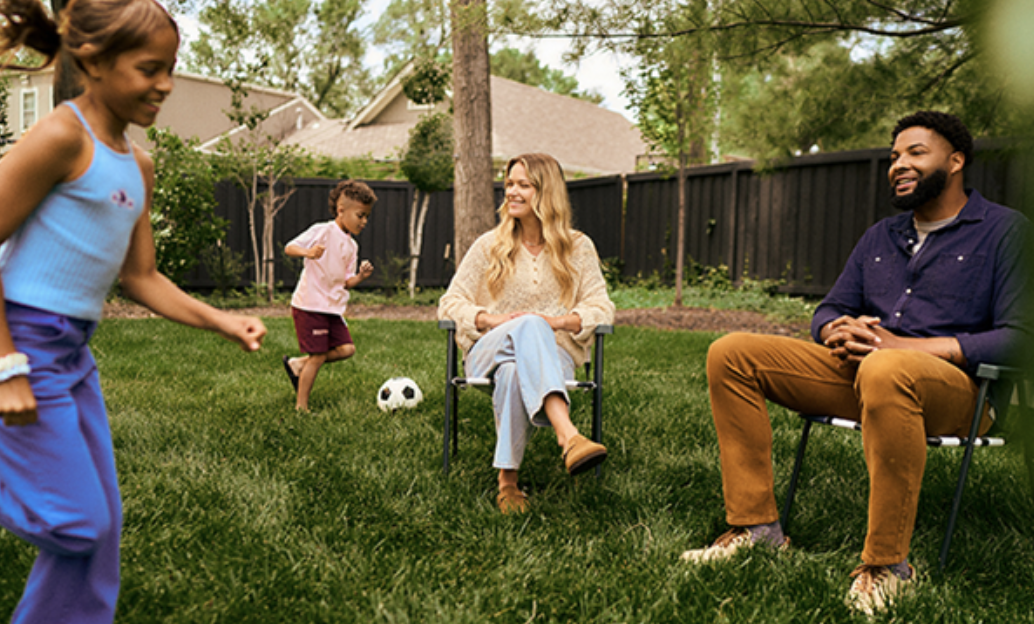 family playing in the yard