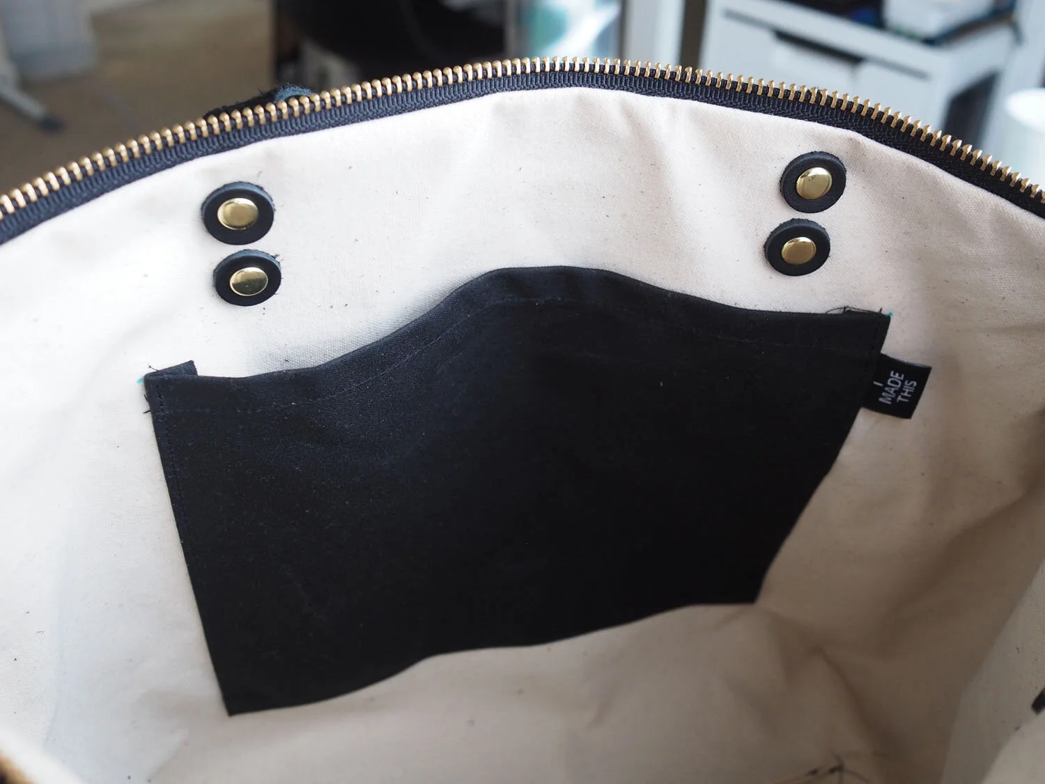  The interior pocket of the purse, and view of the leather washers helping reinforce where the strap is attached. 