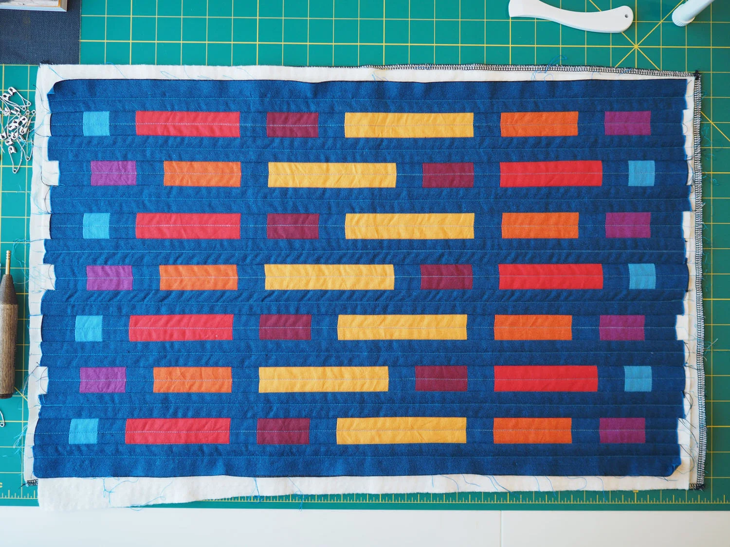  The pillowcase top, fully quilted and ready to be trimmed. 