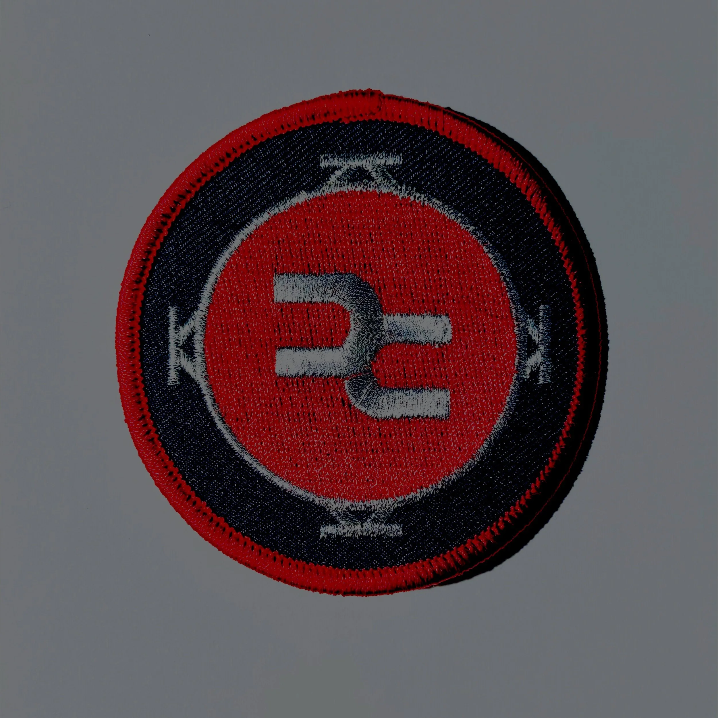 XAMBUCA Embroidered Classic Logo Patch with Red, Black and Silver Thread