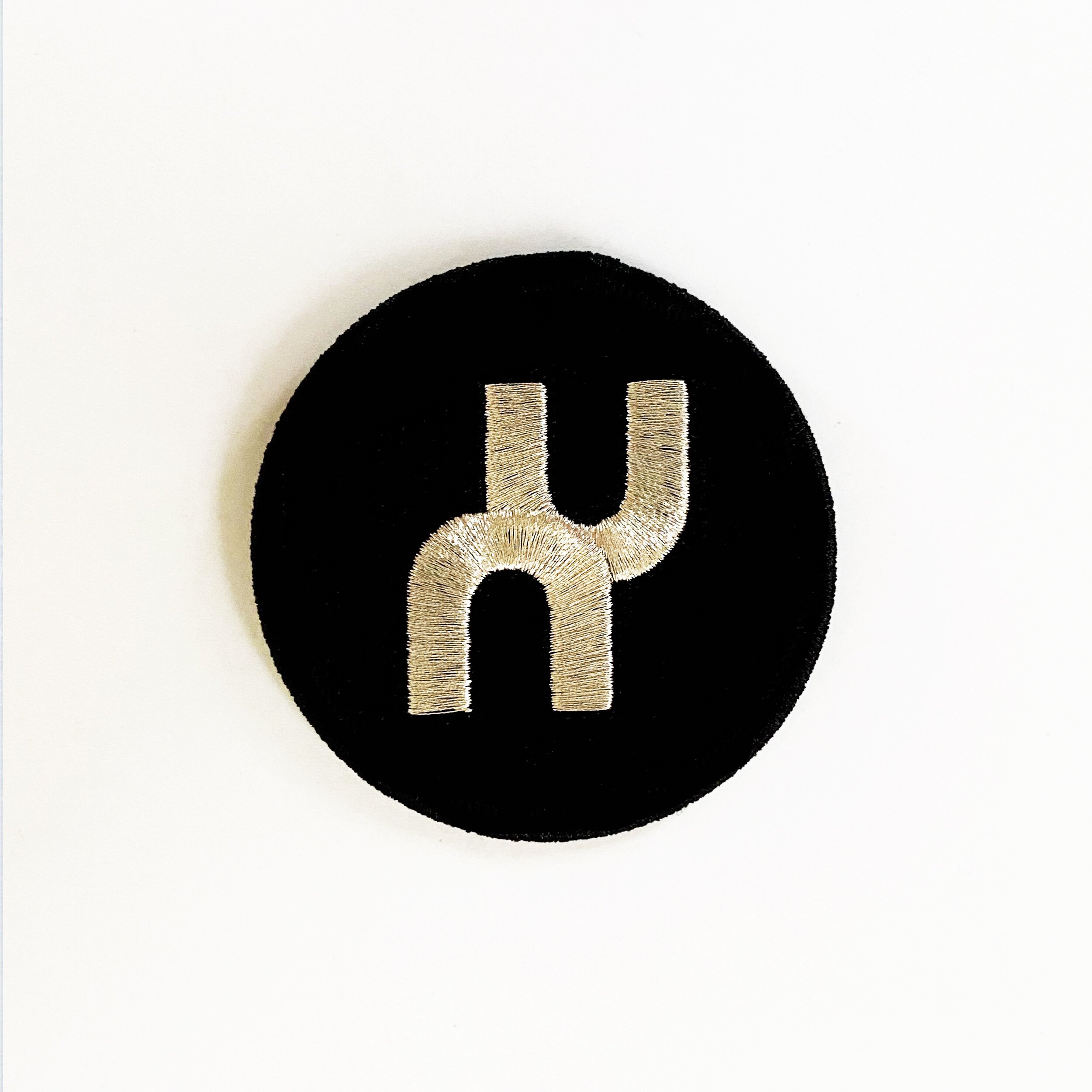 XAMBUCA Modern logo patch (silver on black)