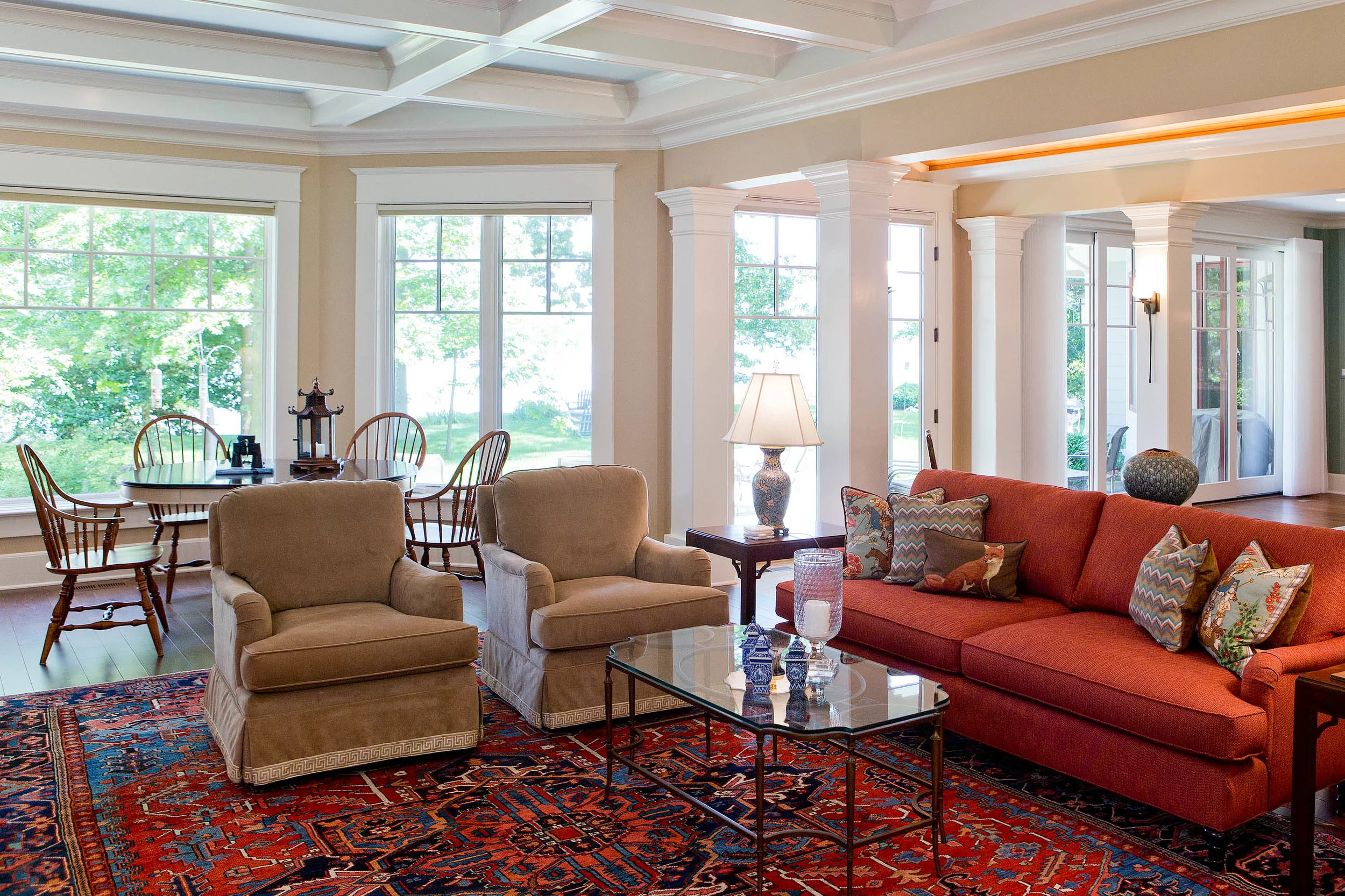 Fawn colored velvet on a pair of swivel chairs provides a soft visual transition from the primary seating zone to the smaller dining and gaming area. Photo: Matthew Lofton