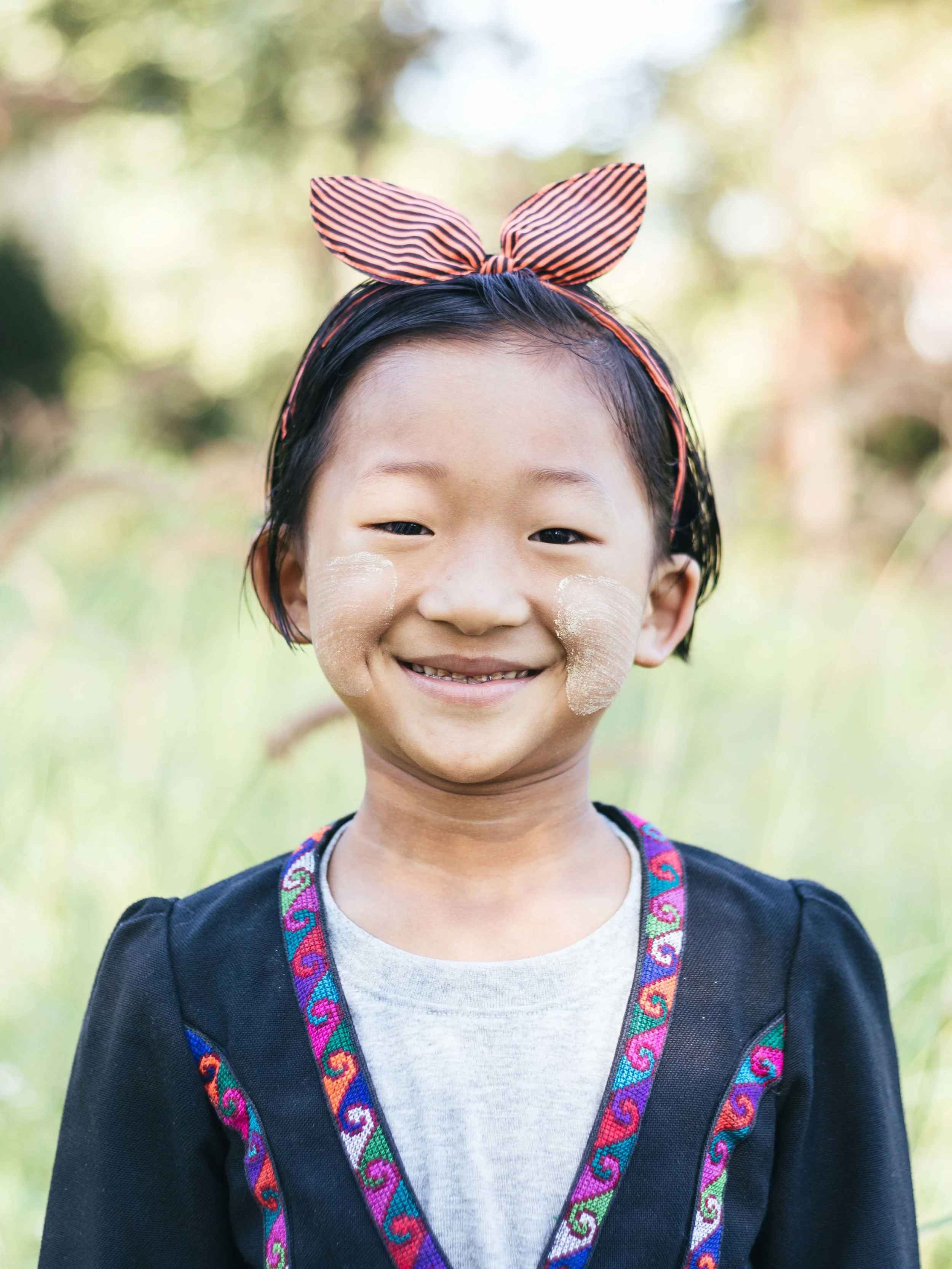 Girl with Thanaka makeup(Burmese sunscreen). Everyone wore traditional clothing for the photo shoot